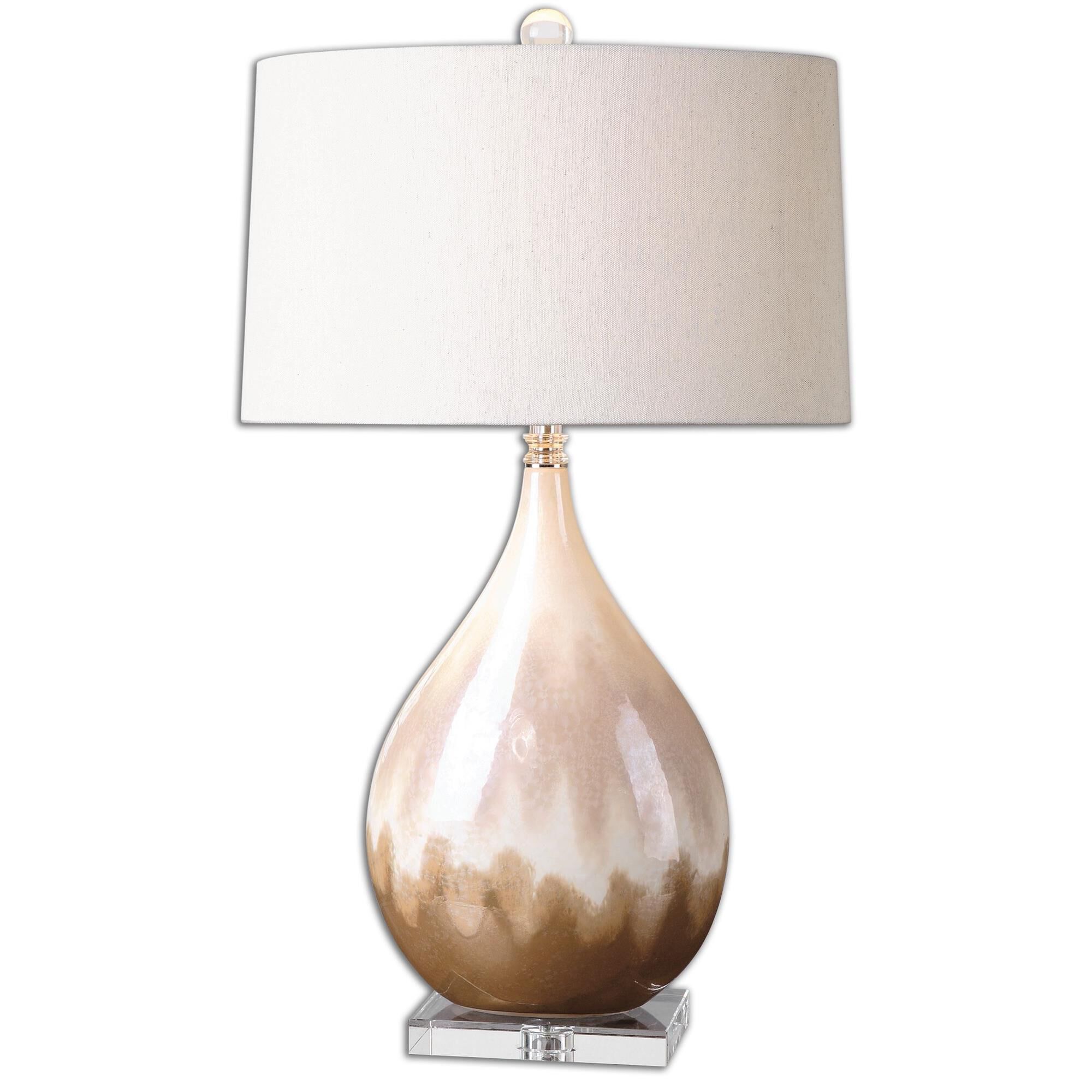 Shown in Ceramic Base Finished In A Metallic Rust Beige Glaze With Ivory Undertones And Crystal Accents finish and Slightly Tapered Oval Hardback shade