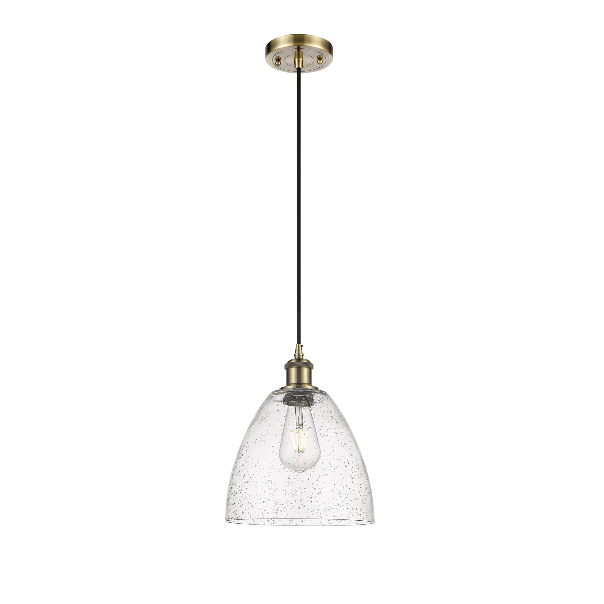 Shown in Antique Brass finish and Seedy glass
