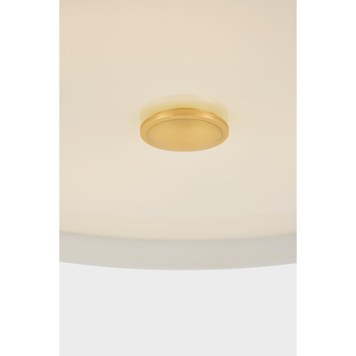 Shown in Aged Brass and Soft White finish and White glass