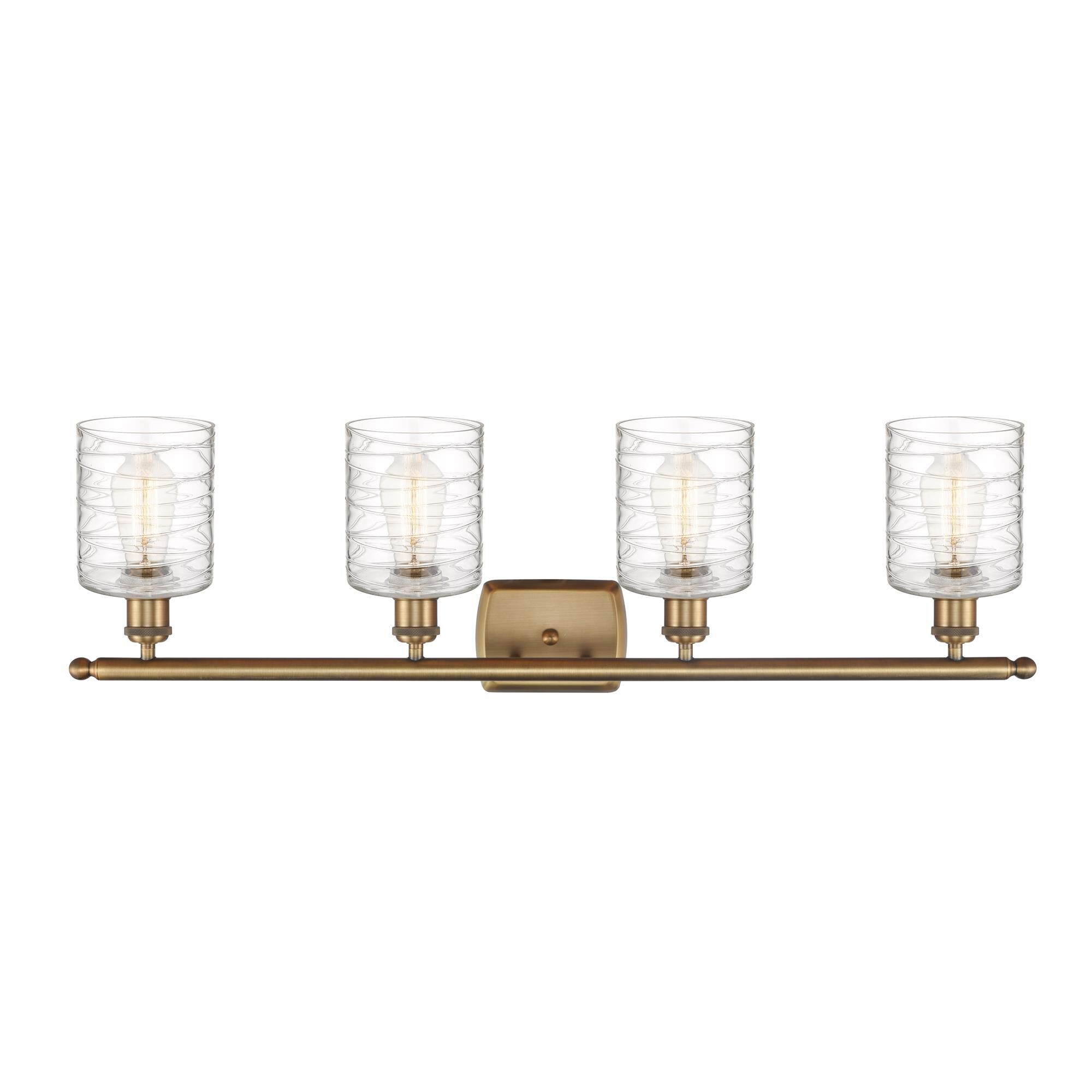 Shown in Brushed Brass finish and Deco Swirl glass
