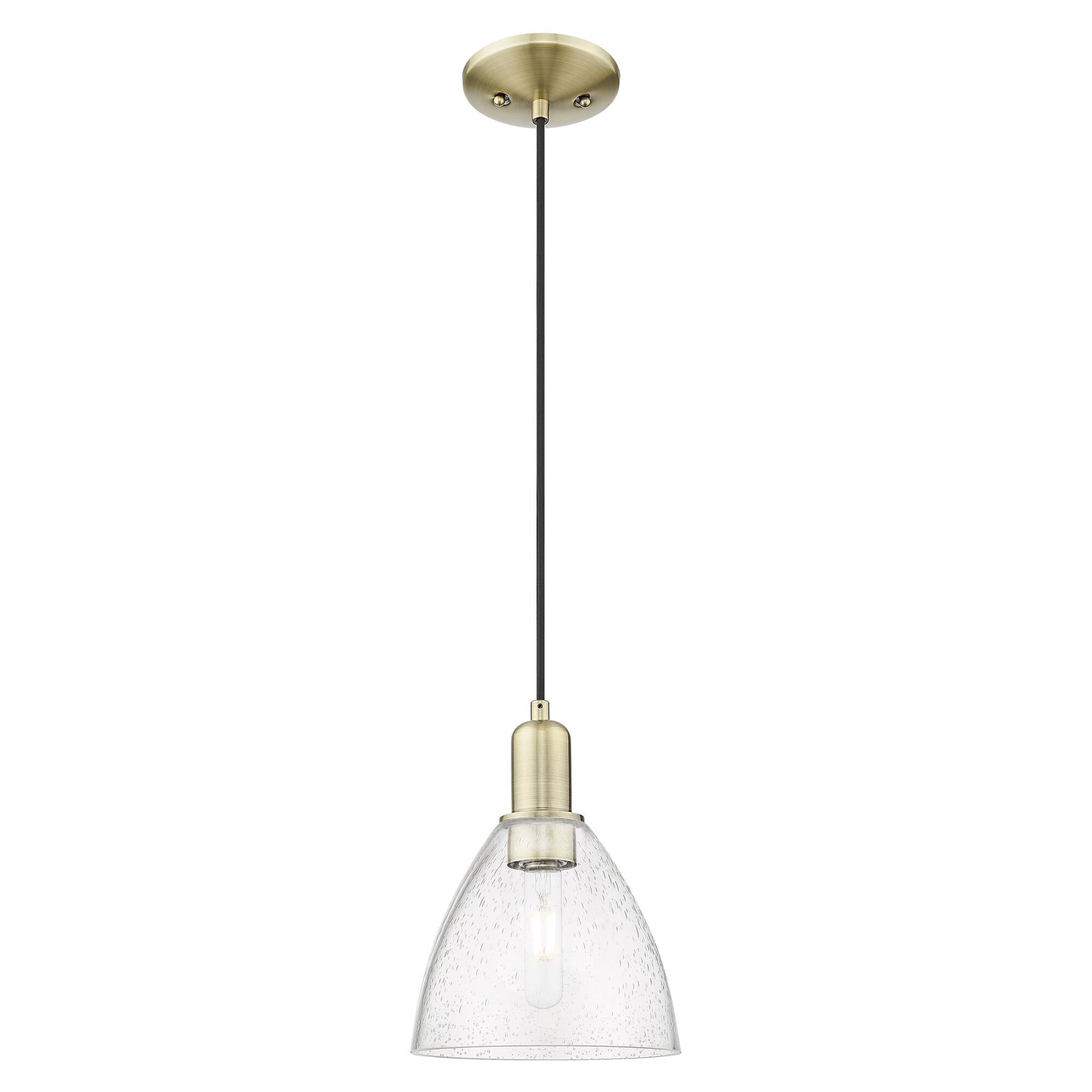 Shown in Antique Brass finish and Seedy glass