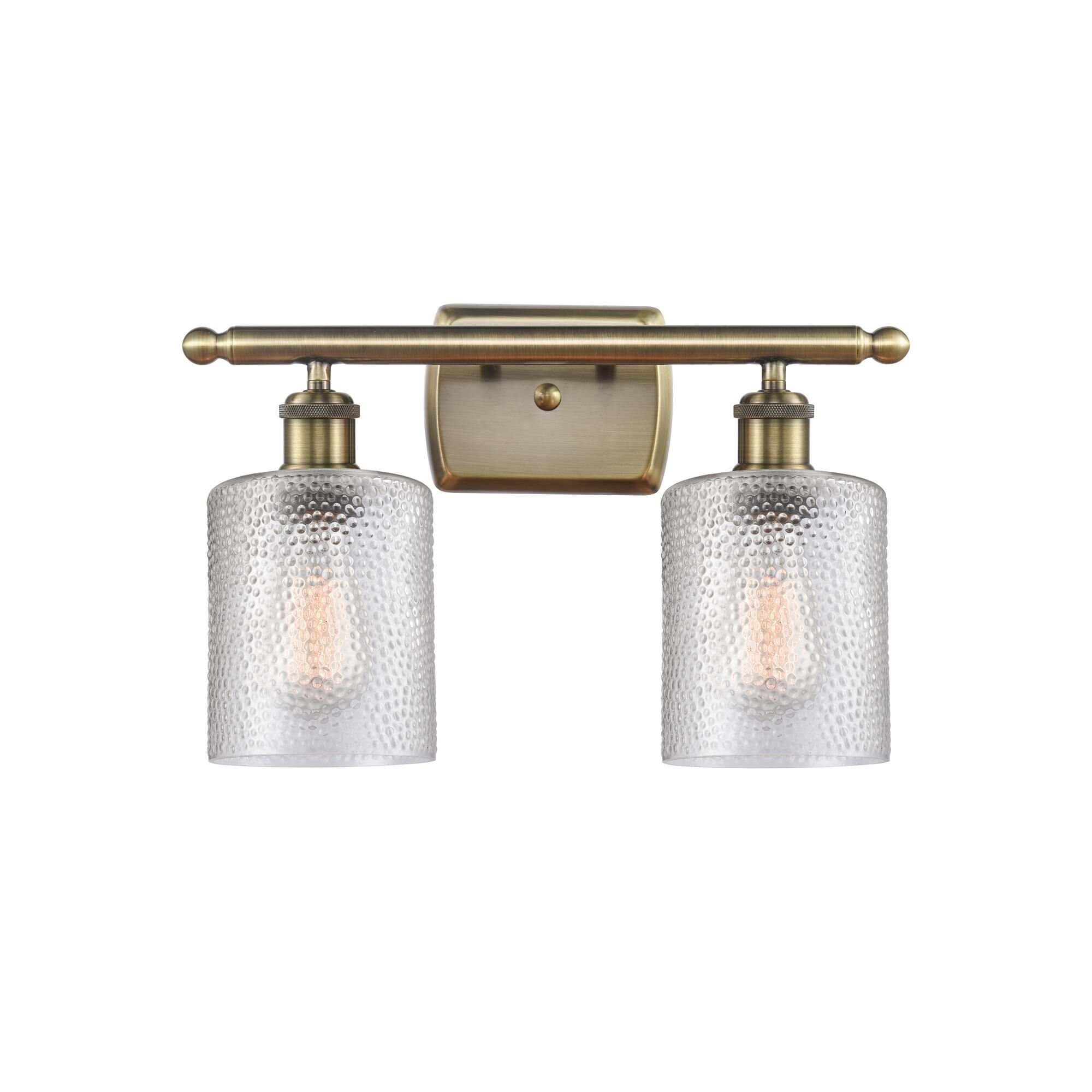 Shown in Antique Brass finish and Clear Cobbleskill glass and None shade