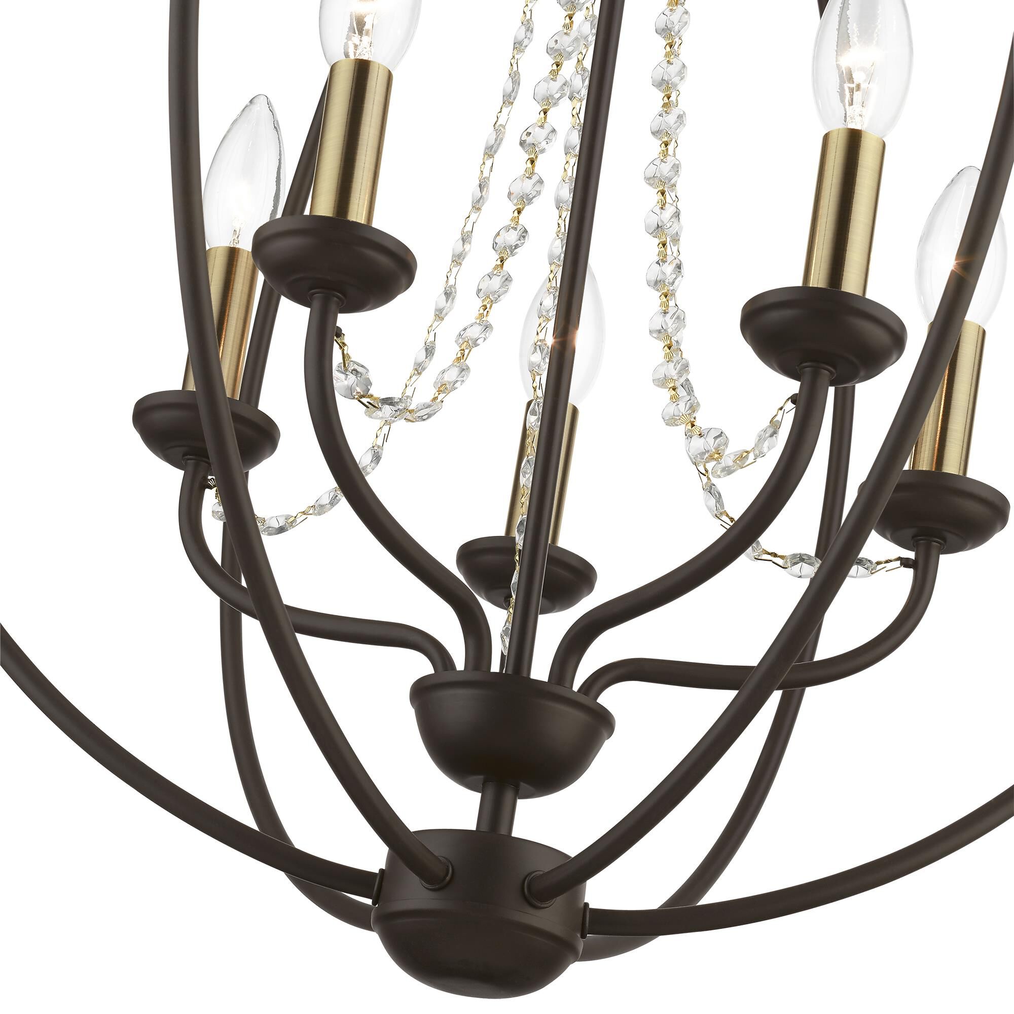 Shown in Bronze with Antique Brass Finish Candles finish and Clear Crystals shade