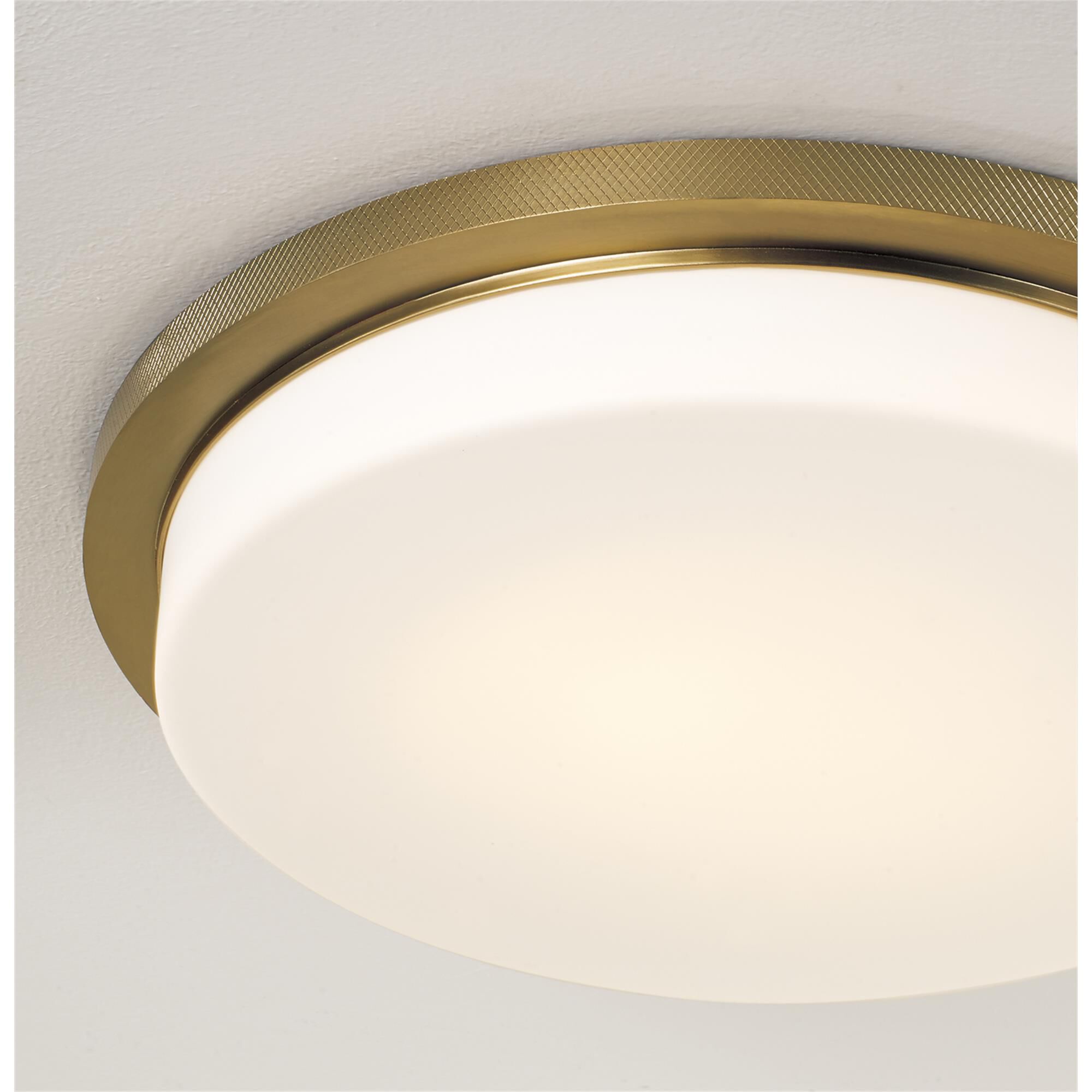 Shown in Aged Brass finish and Soft White glass