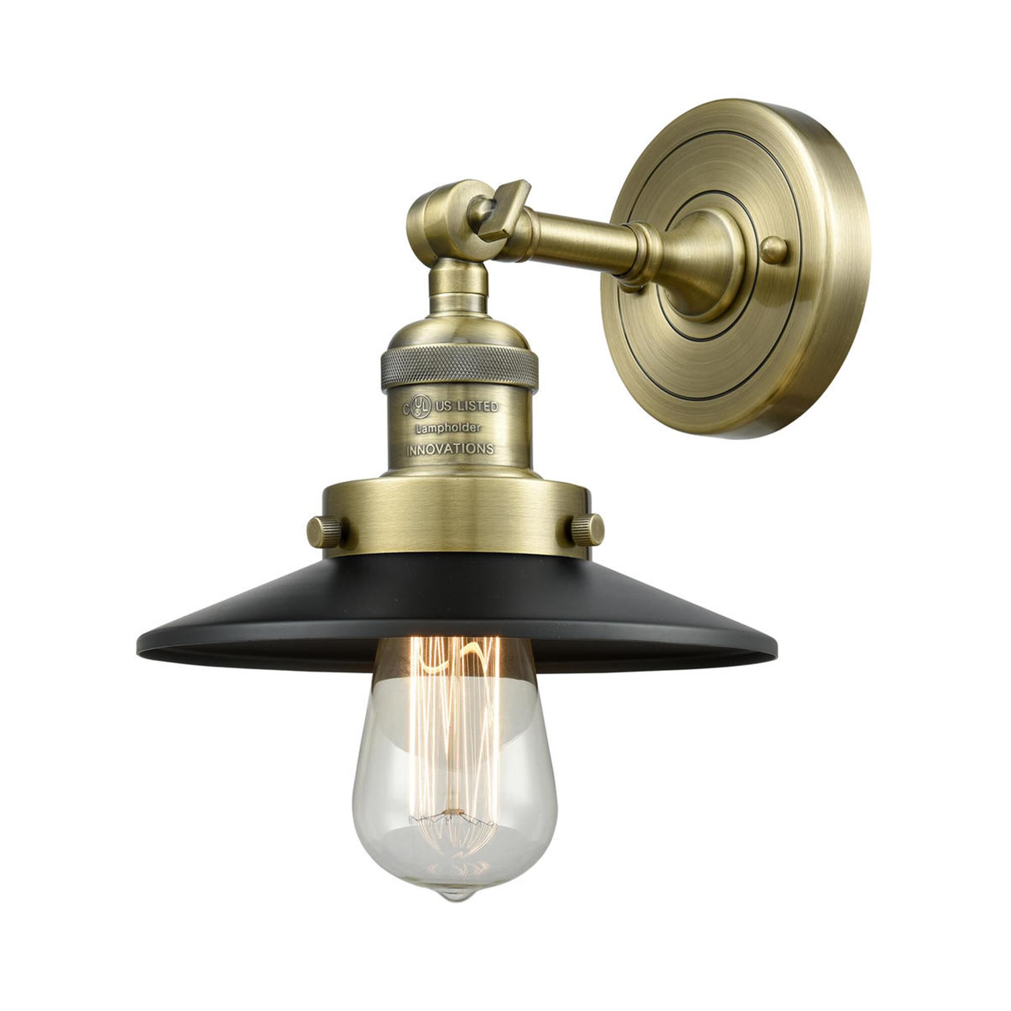 Shown in Antique Brass finish and Antique Brass glass and Matte Black shade and No Accent accent