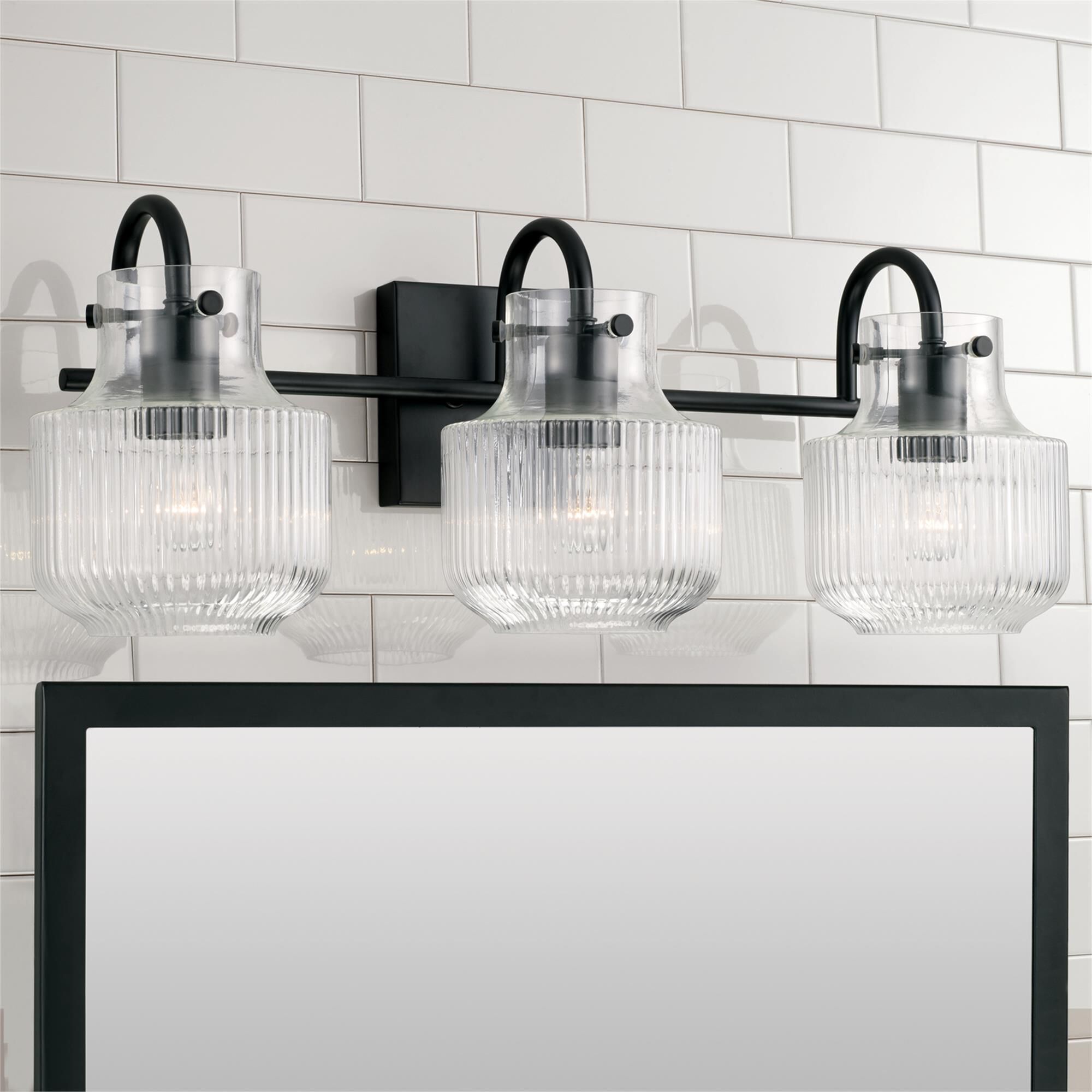 Shown in Matte Black finish and Clear Fluted glass