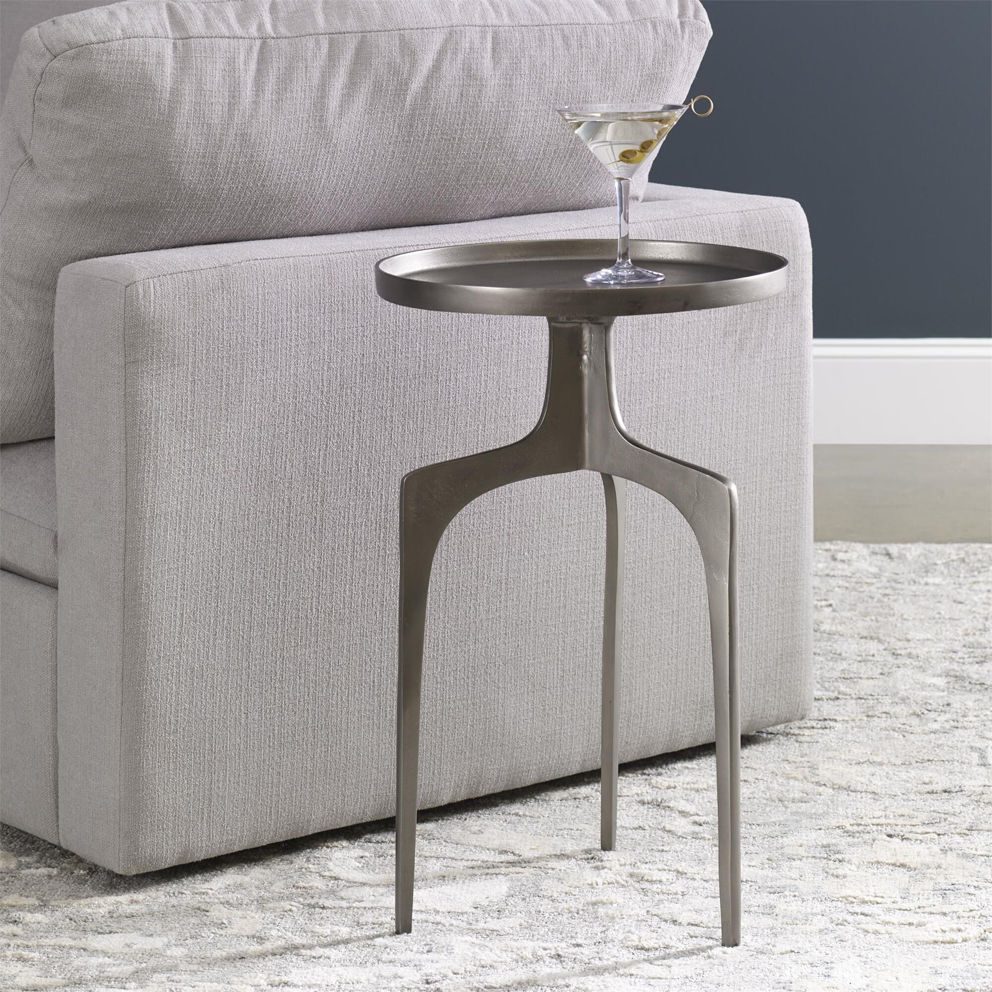 Shown in Providing An Organic Global Feel, This Cast Aluminum Accent Table Features A Shapely Curved Base And finish