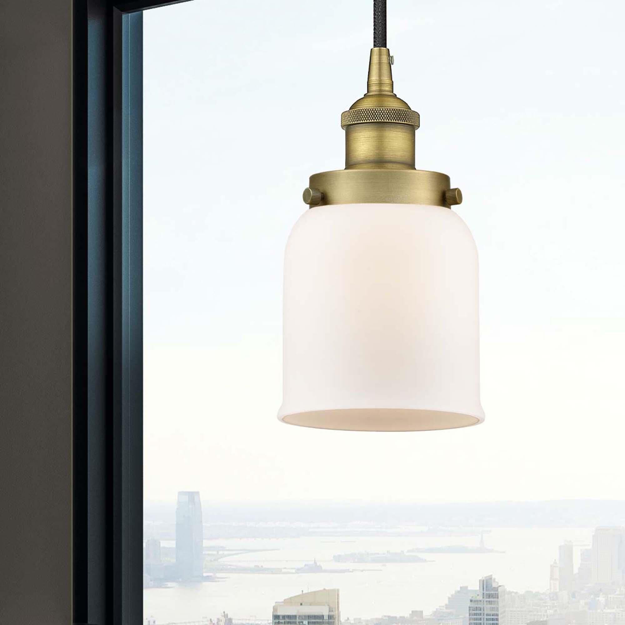 Shown in Brushed Brass finish and Matte White glass