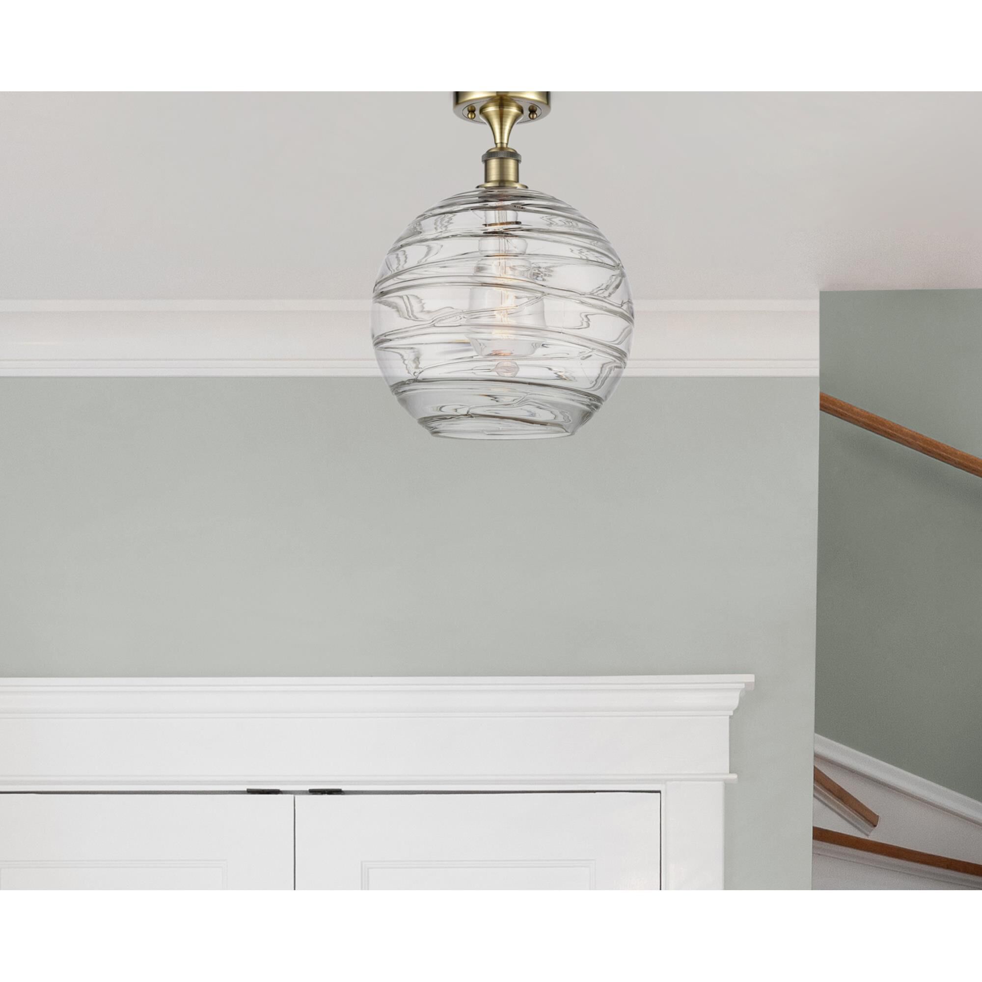 Shown in Antique Brass finish and Clear X-Large Deco Swirl glass and None shade