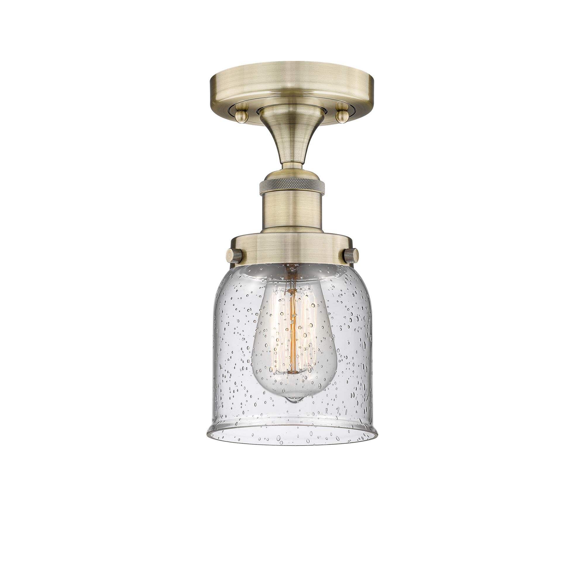 Shown in Antique Brass finish and Seedy glass