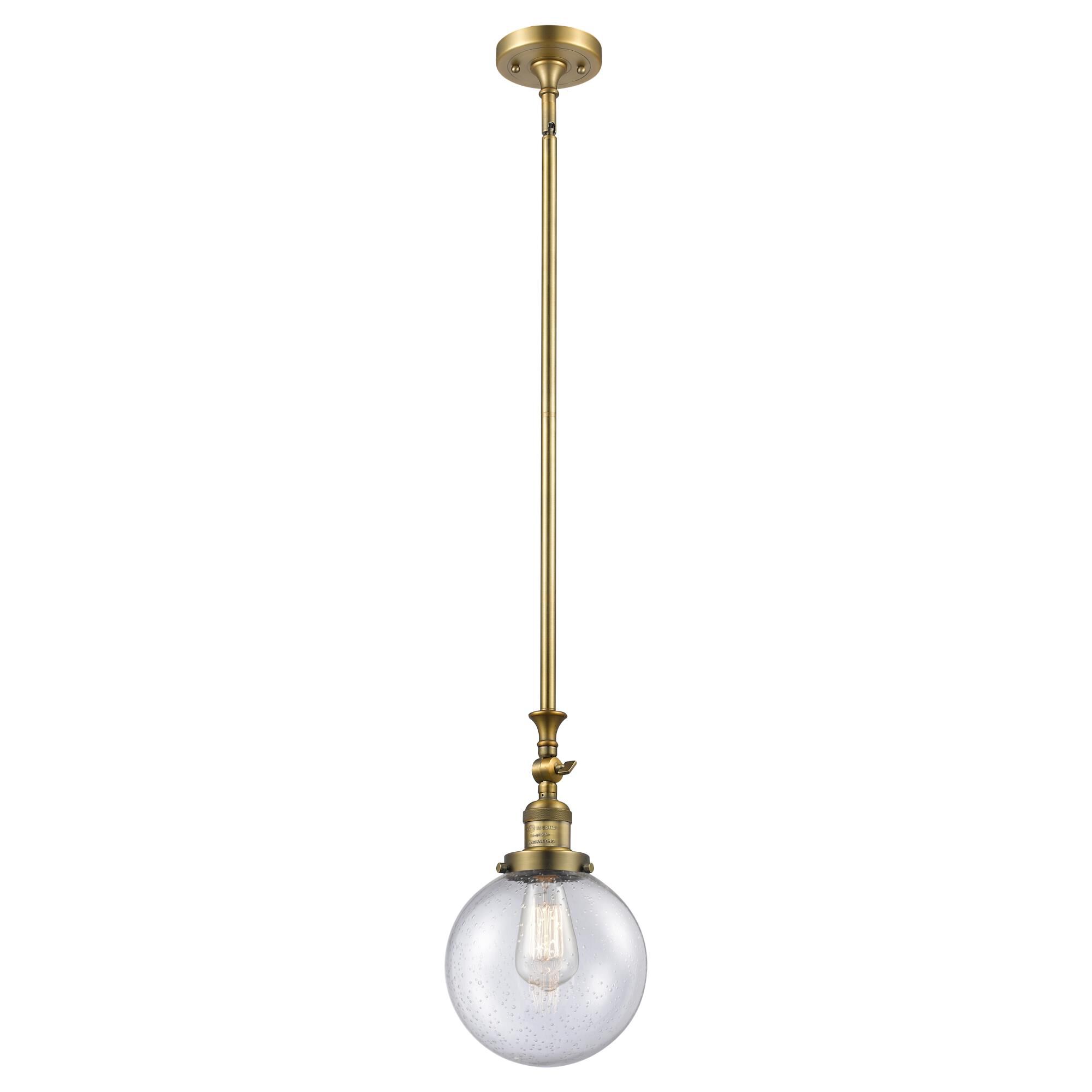 Shown in Brushed Brass finish and Seedy glass