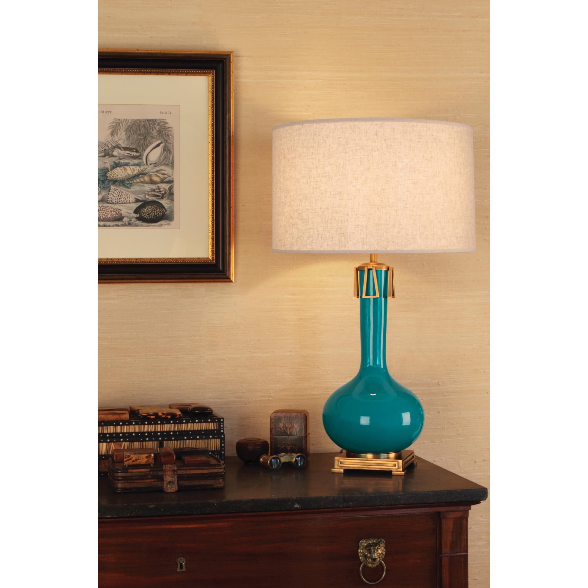 Shown in Peacock Glazed Ceramic with Aged Brass Accents finish and Open Weave Heather Linen shade