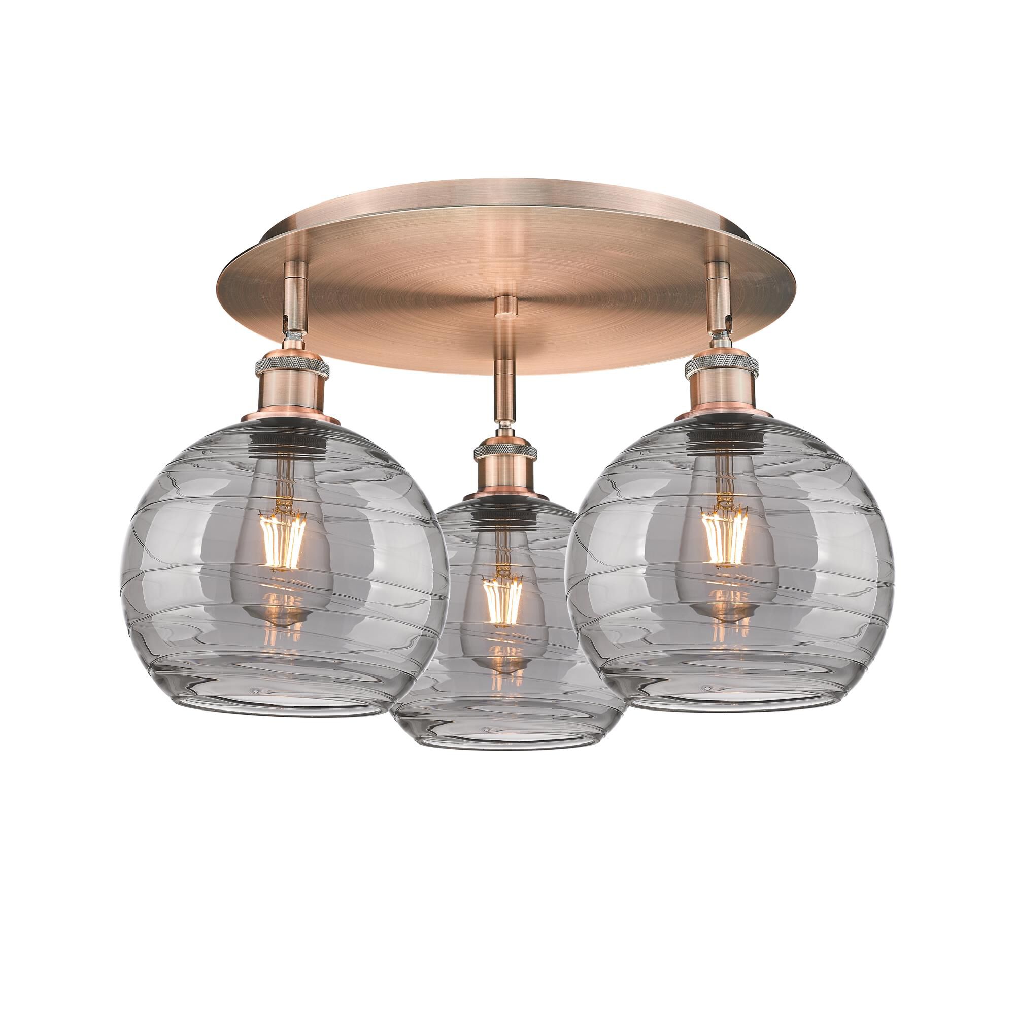 Shown in Antique Copper finish and Light Smoke Deco Swirl glass