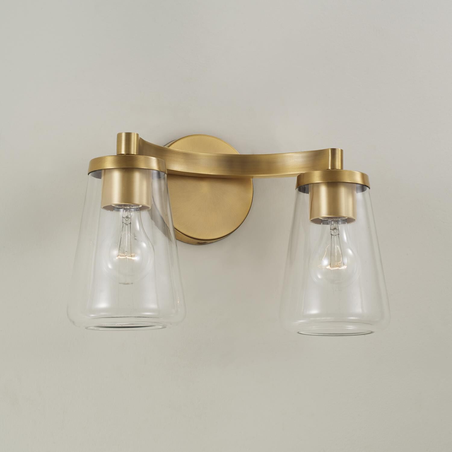 Shown in Aged Brass finish and Clear glass