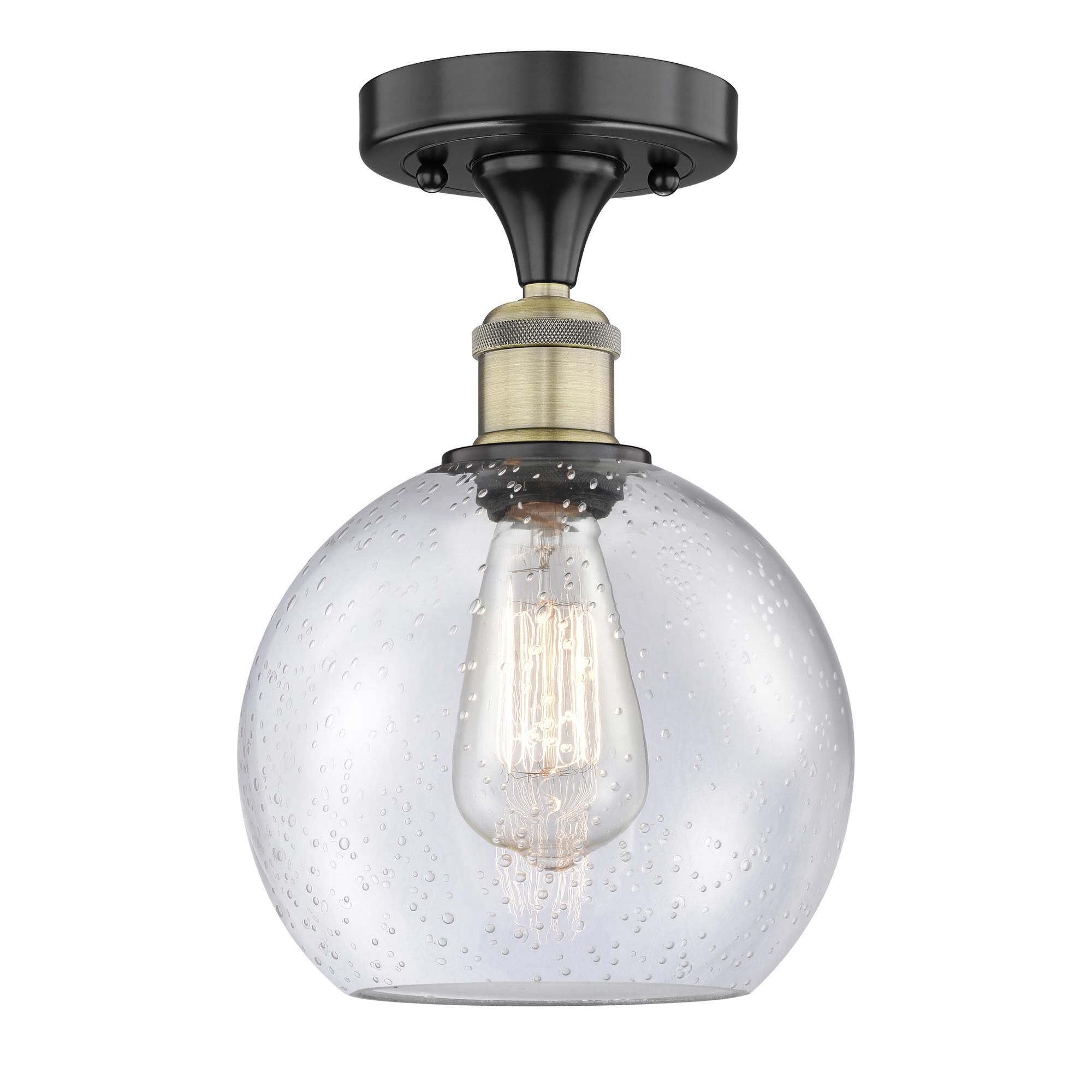 Shown in Black Antique Brass finish and Seedy glass