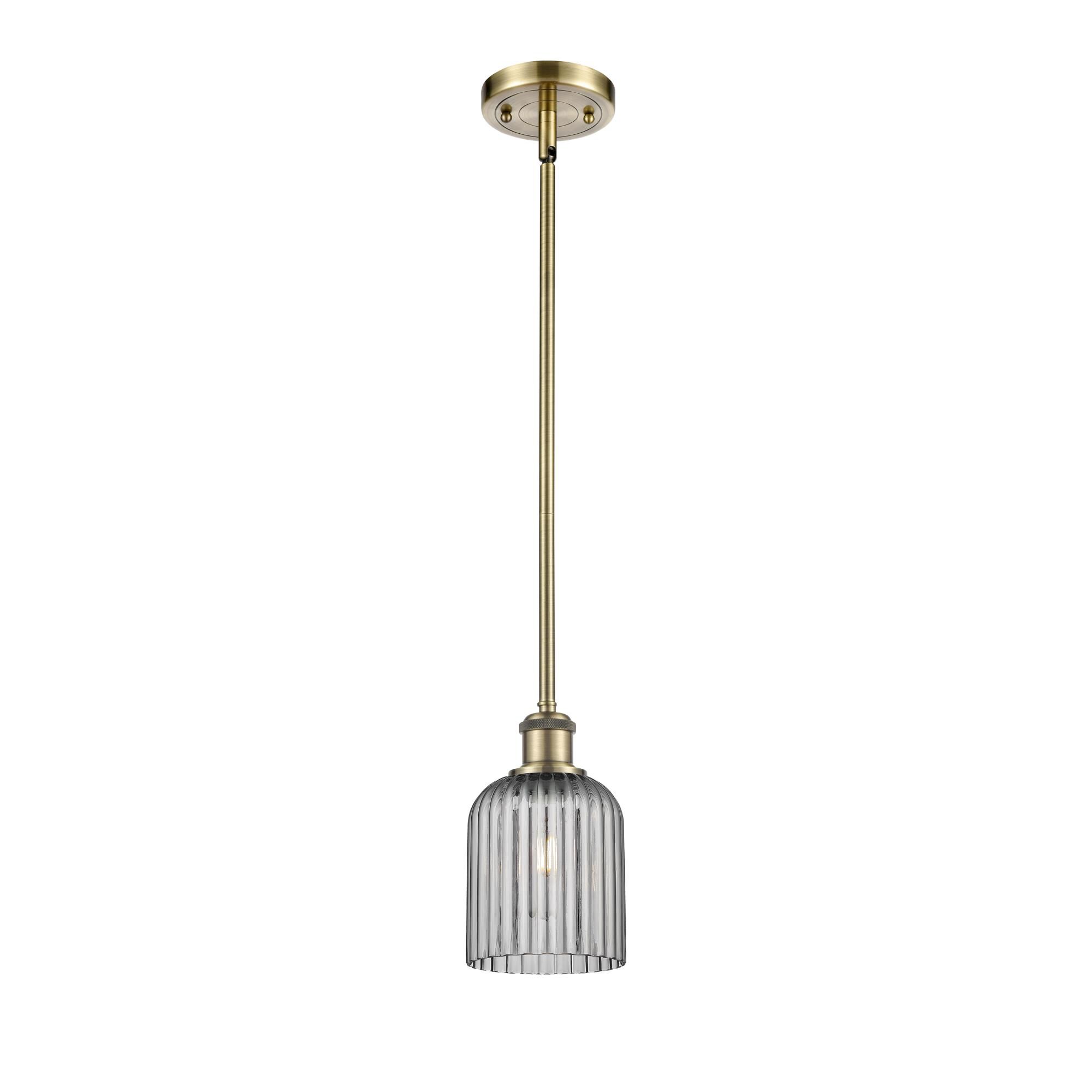 Shown in Antique Brass finish and Light Smoke shade