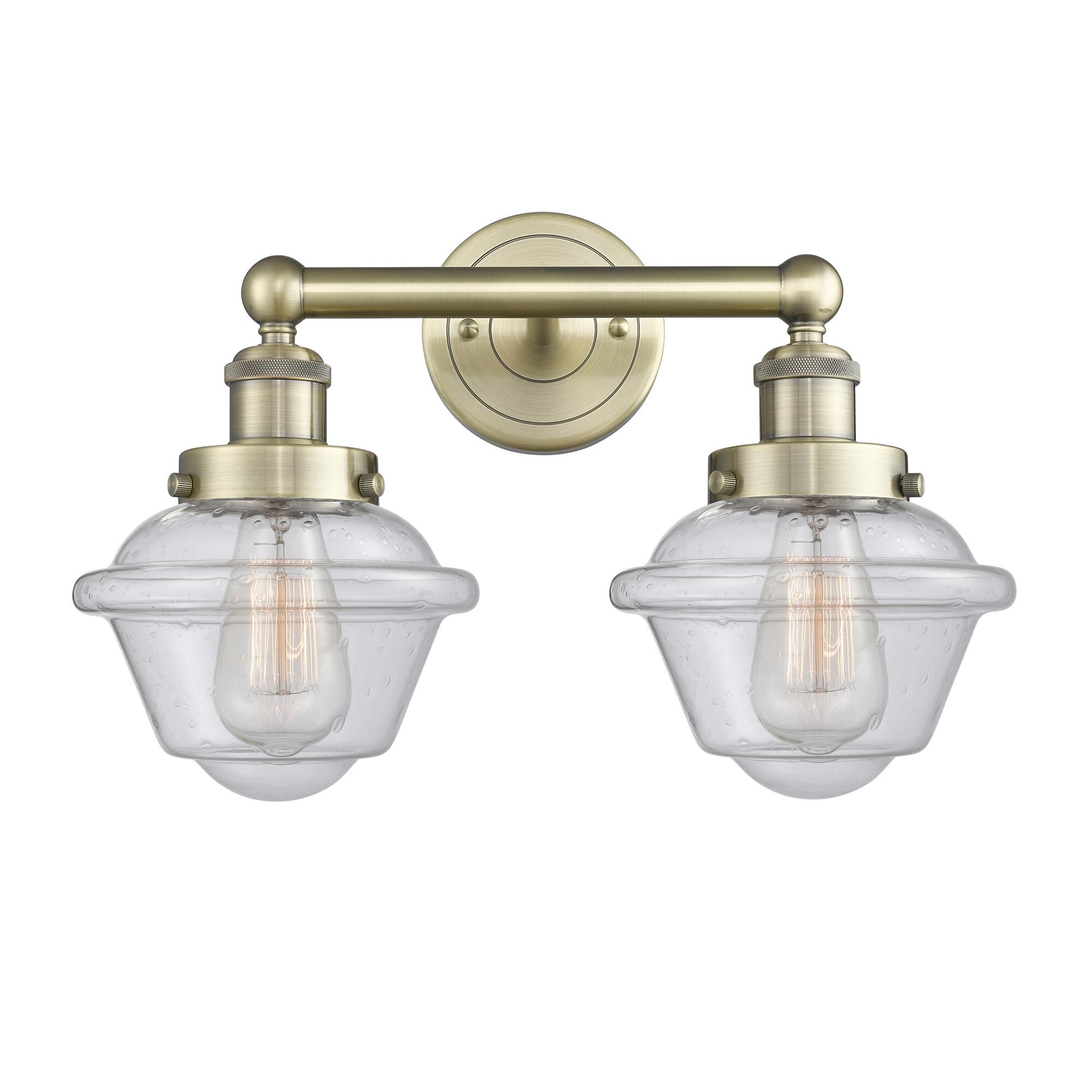 Shown in Antique Brass finish and Seedy glass