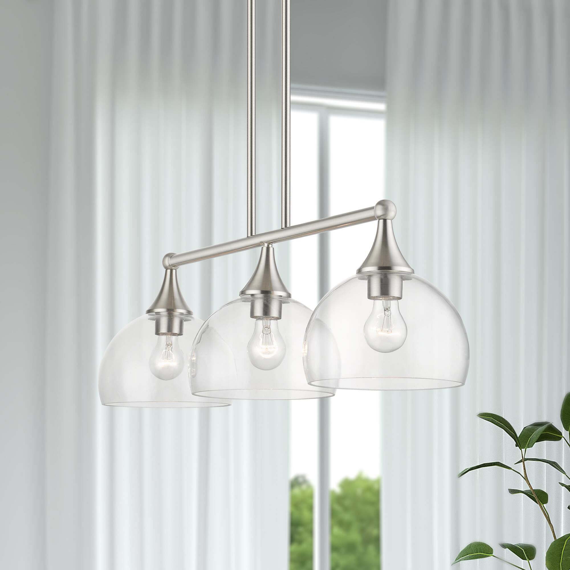 Shown in Brushed Nickel finish and Clear Hand Blown glass