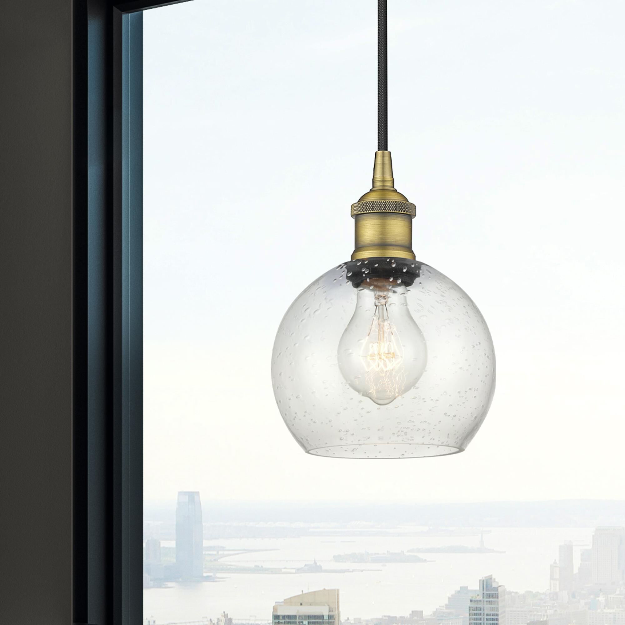 Shown in Brushed Brass finish and Seedy glass