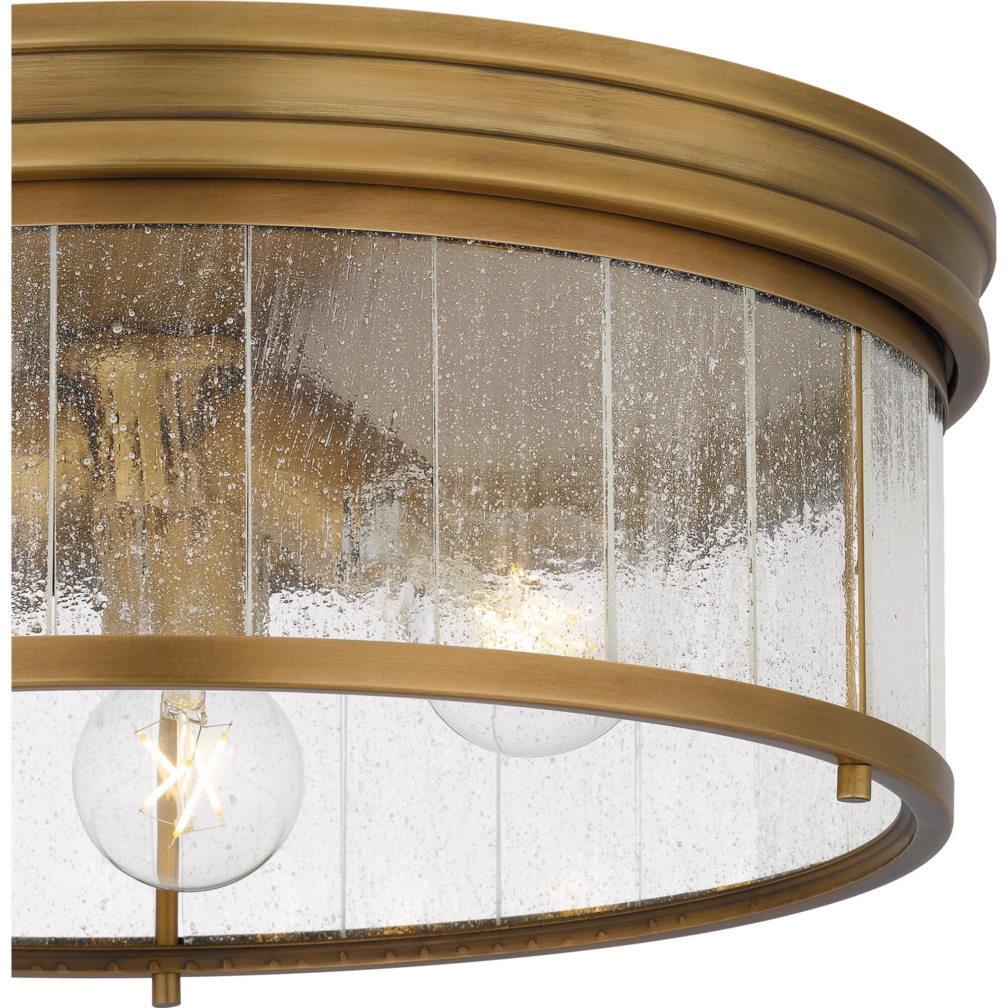 Shown in Weathered Brass finish and Clear Seedy Glass shade