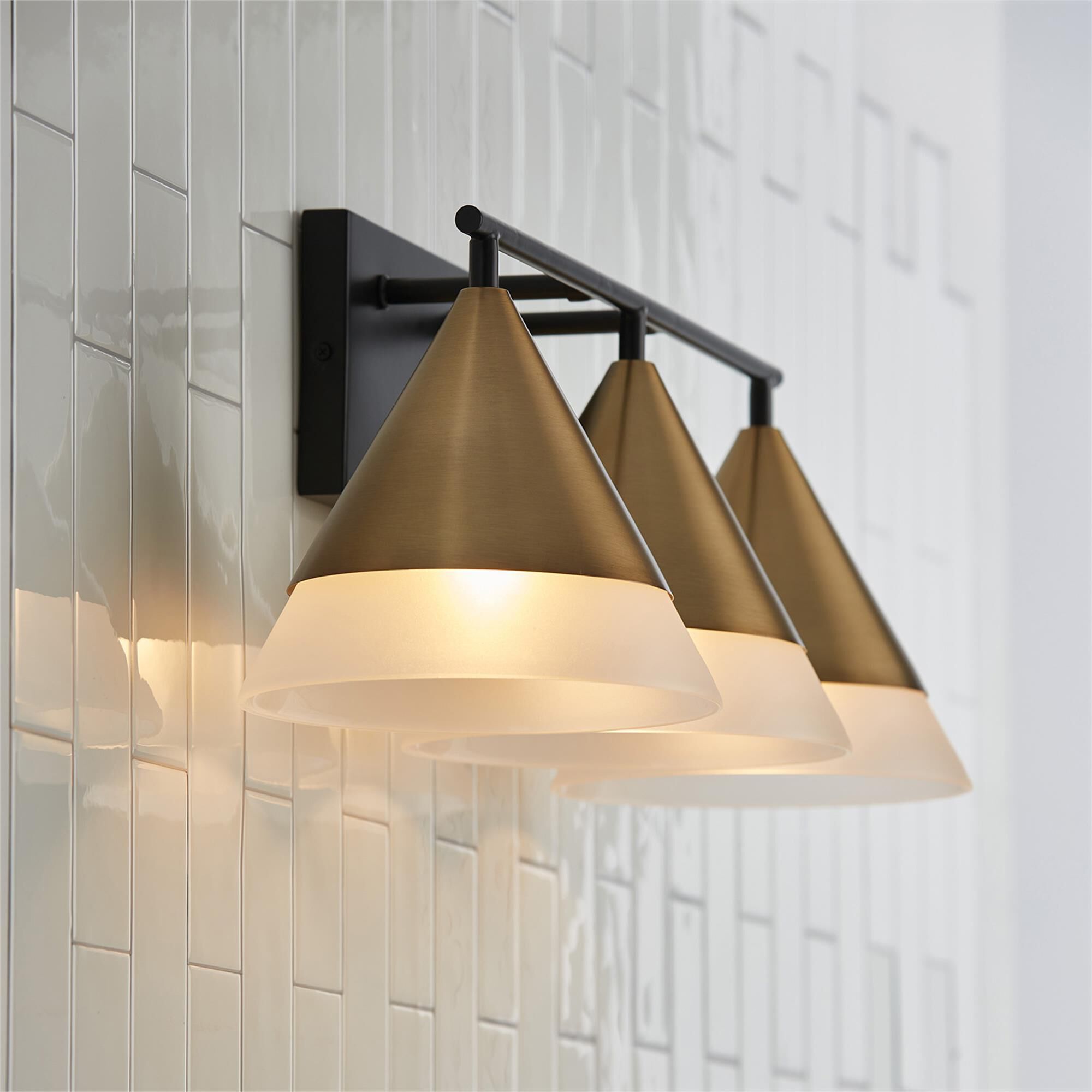 Shown in Aged Brass And Black finish and Frosted glass