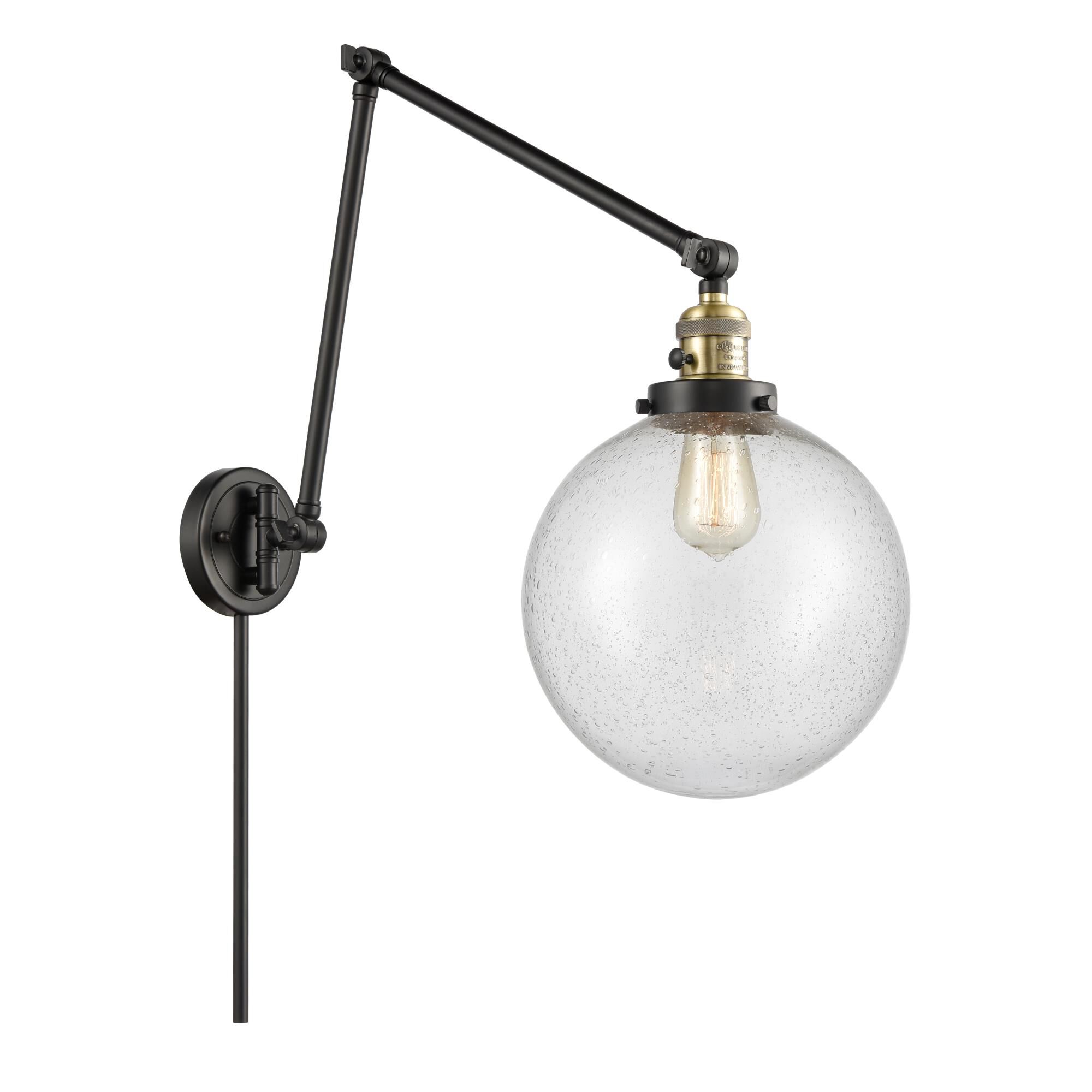 Shown in Black Antique Brass finish and Seedy Beacon glass
