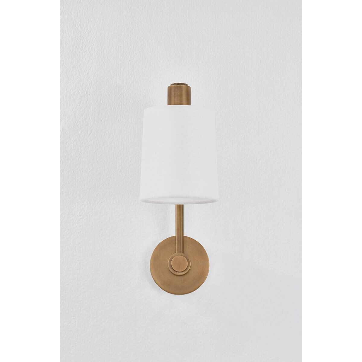 Shown in Patina Brass finish and Off White Linen shade
