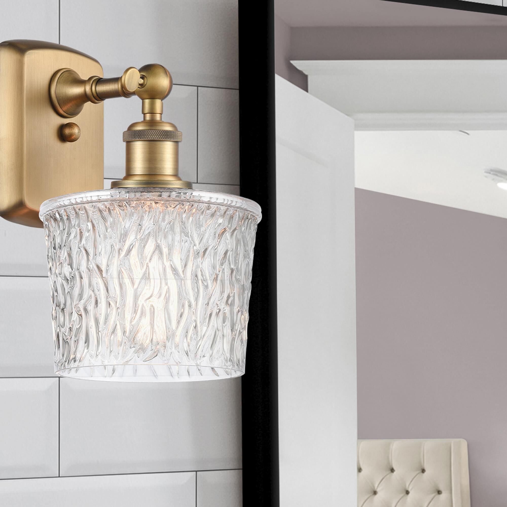 Shown in Brushed Brass finish and Clear Niagra glass and Polished Chrome accent