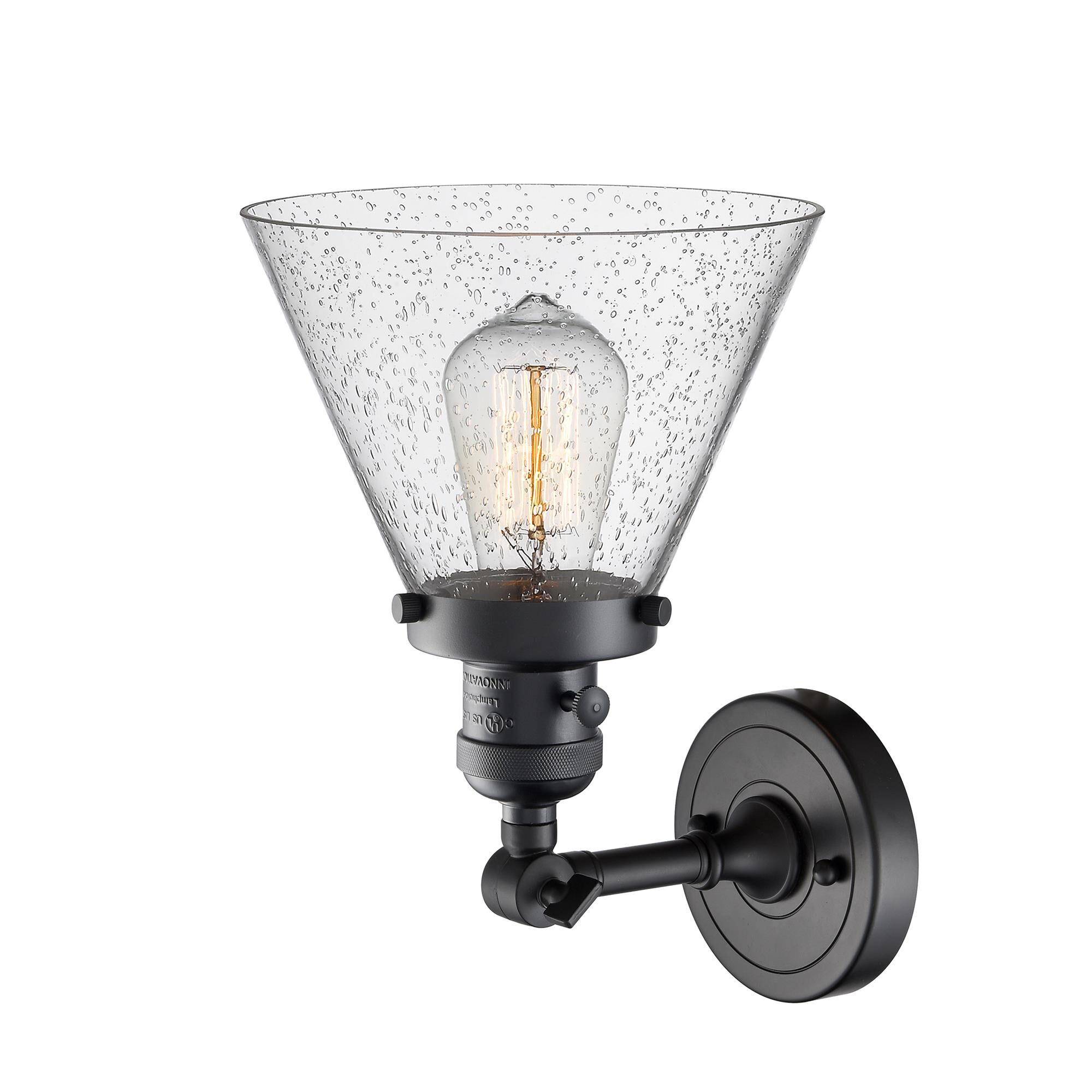 Shown in Matte Black finish and Seedy glass and Brushed Satin Nickel shade and Switch on Socket accent