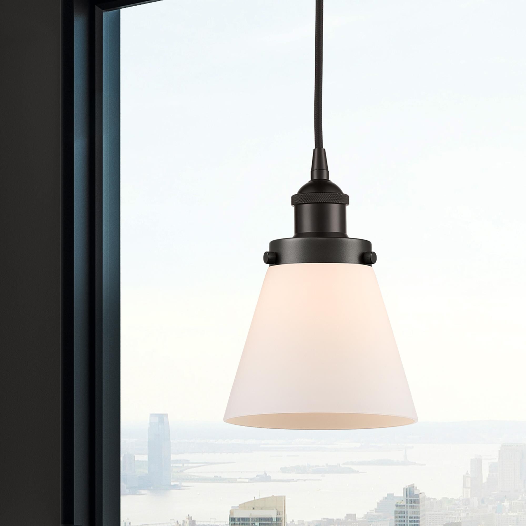 Shown in Oil Rubbed Bronze finish and Matte White Cased Small Cone glass