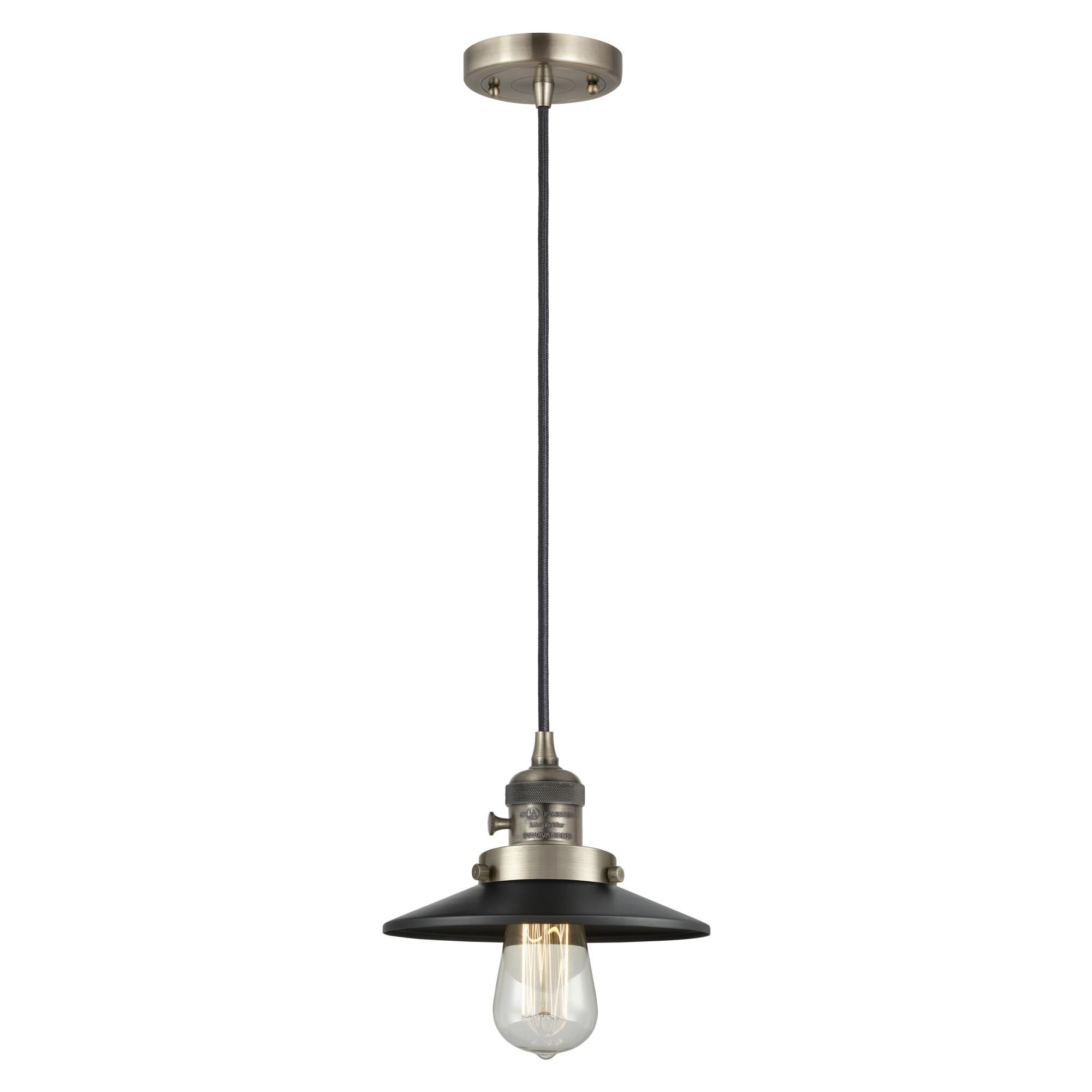 Shown in Antique Brass finish and Matte Black shade