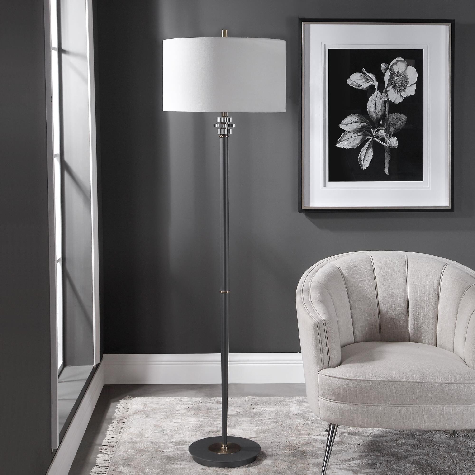 Shown in Transitional In Design, This Floor Lamp Features A Sleek Steel Base Finished In A Dark Bronze, Accen finish and Round Hardback  With Linning Background shade