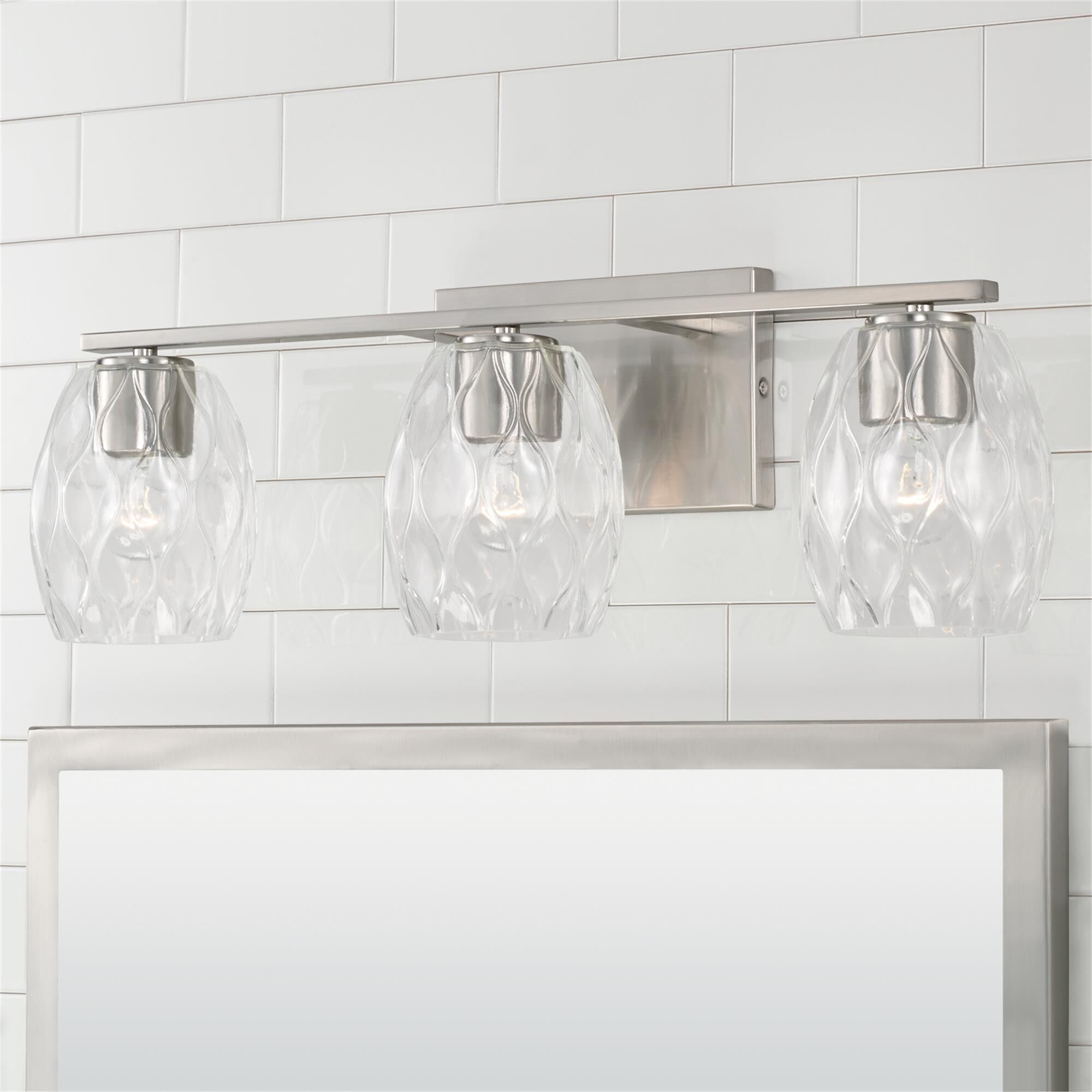 Shown in Brushed Nickel finish and Wavy Embossed glass