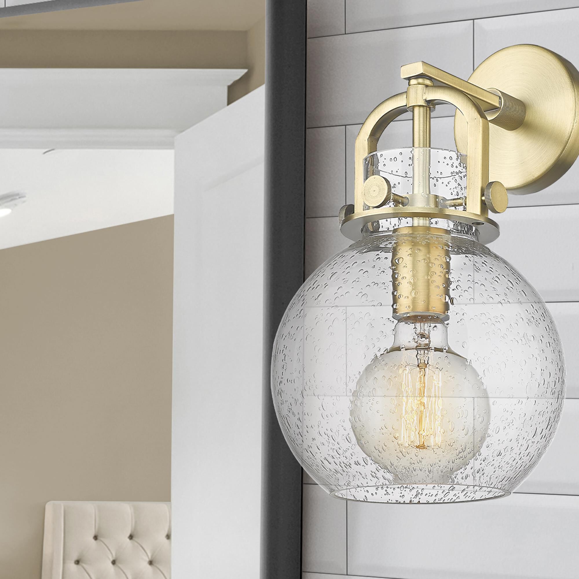 Shown in Brushed Brass finish and Seedy glass