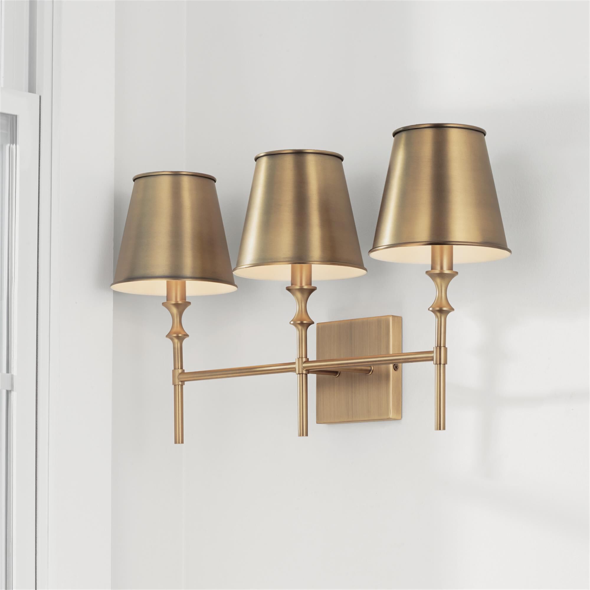 Shown in Aged Brass finish and Aged Brass Metal  with White Interior shade