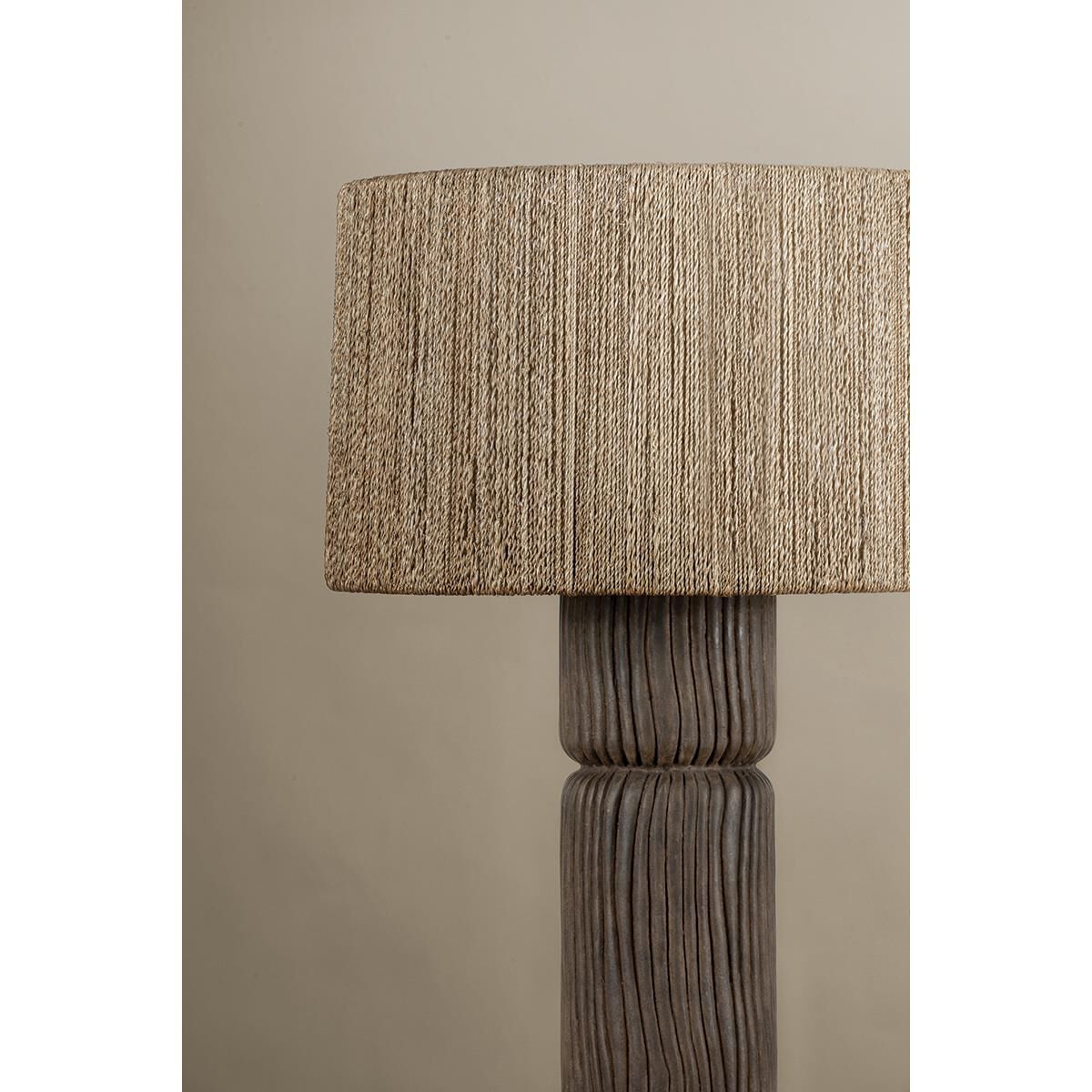 Shown in Patina Brass and Ceramic Shadowed Bark finish and Abaca shade