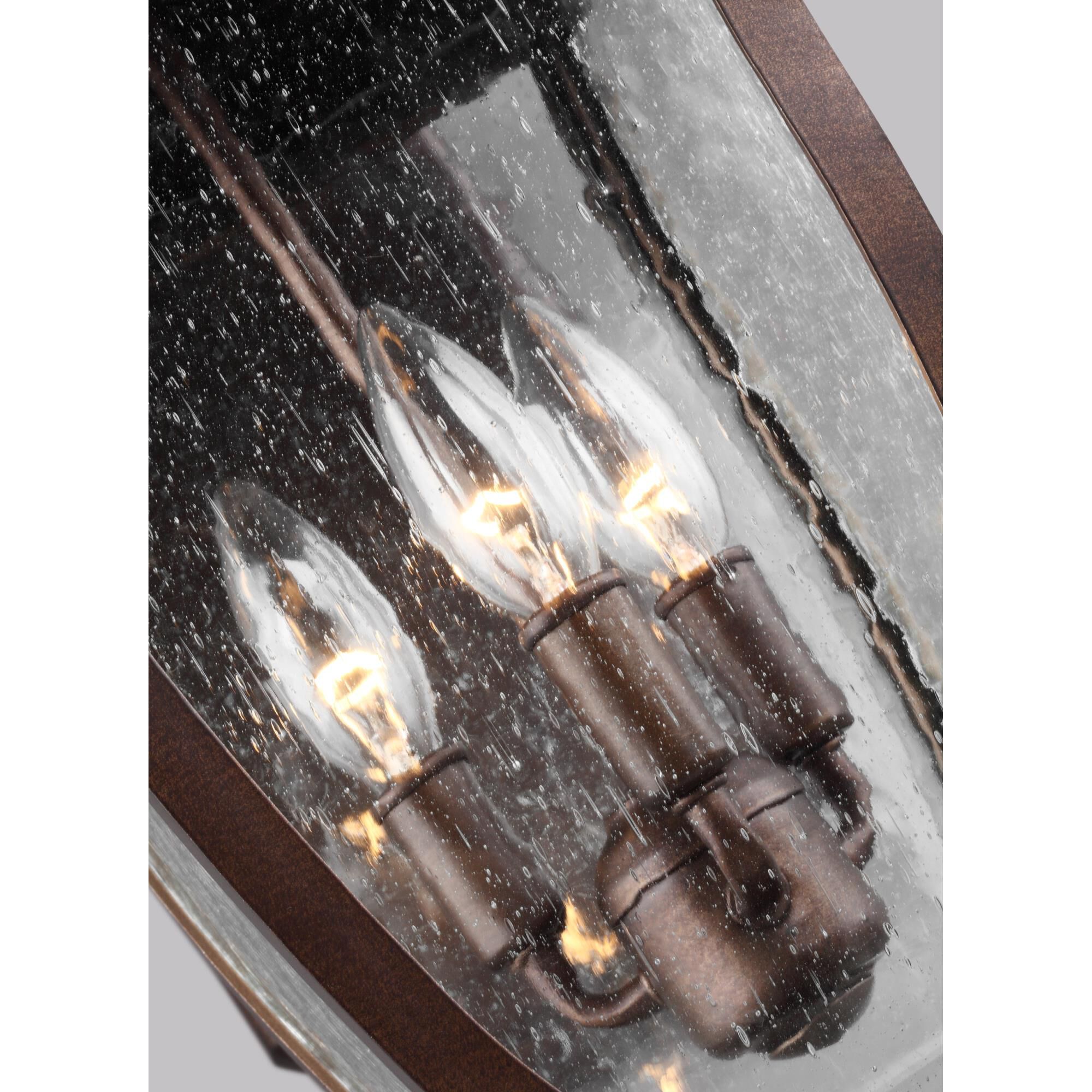 Shown in Patina Bronze finish and Clear Seeded Panels glass