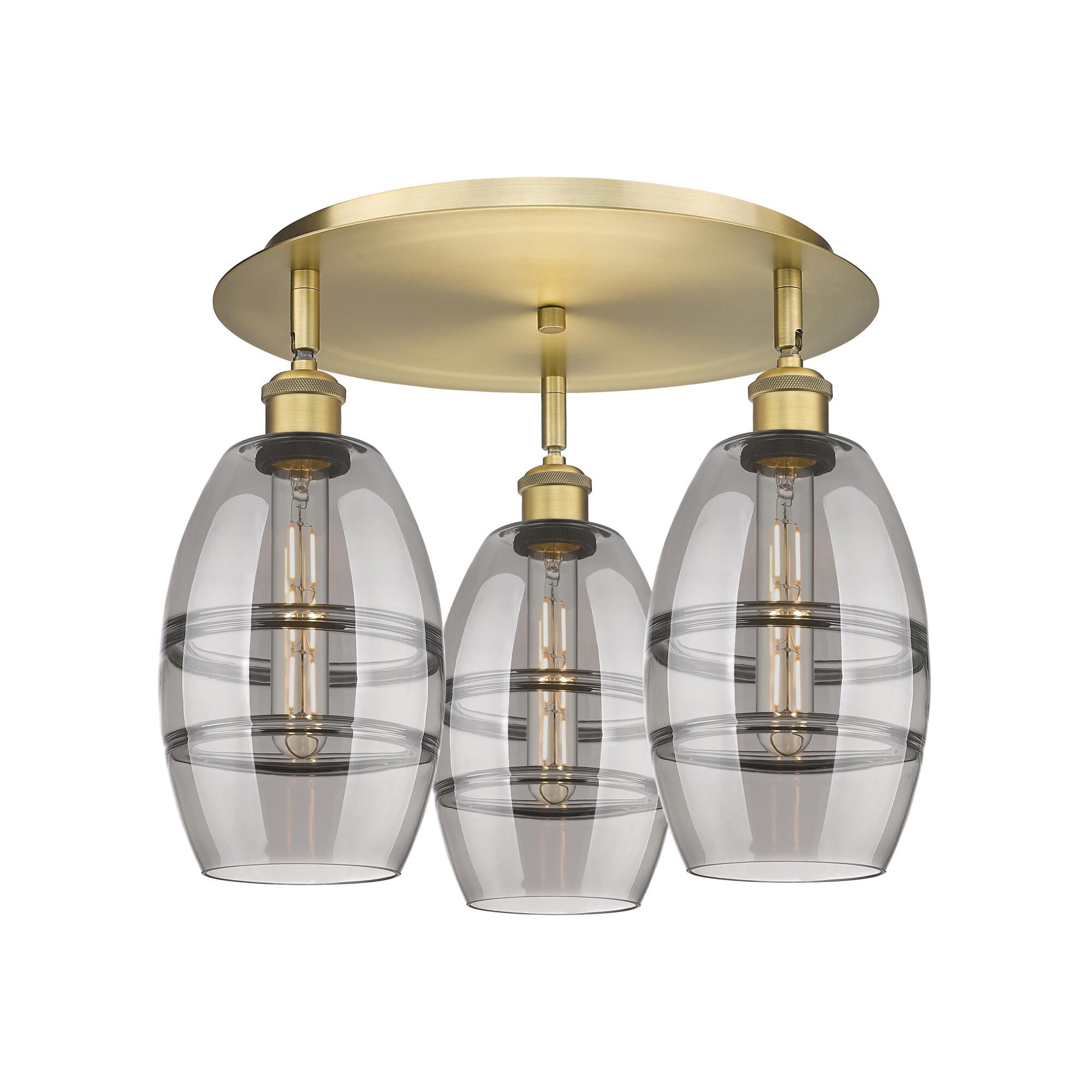 Shown in Brushed Brass finish and Light Smoke glass