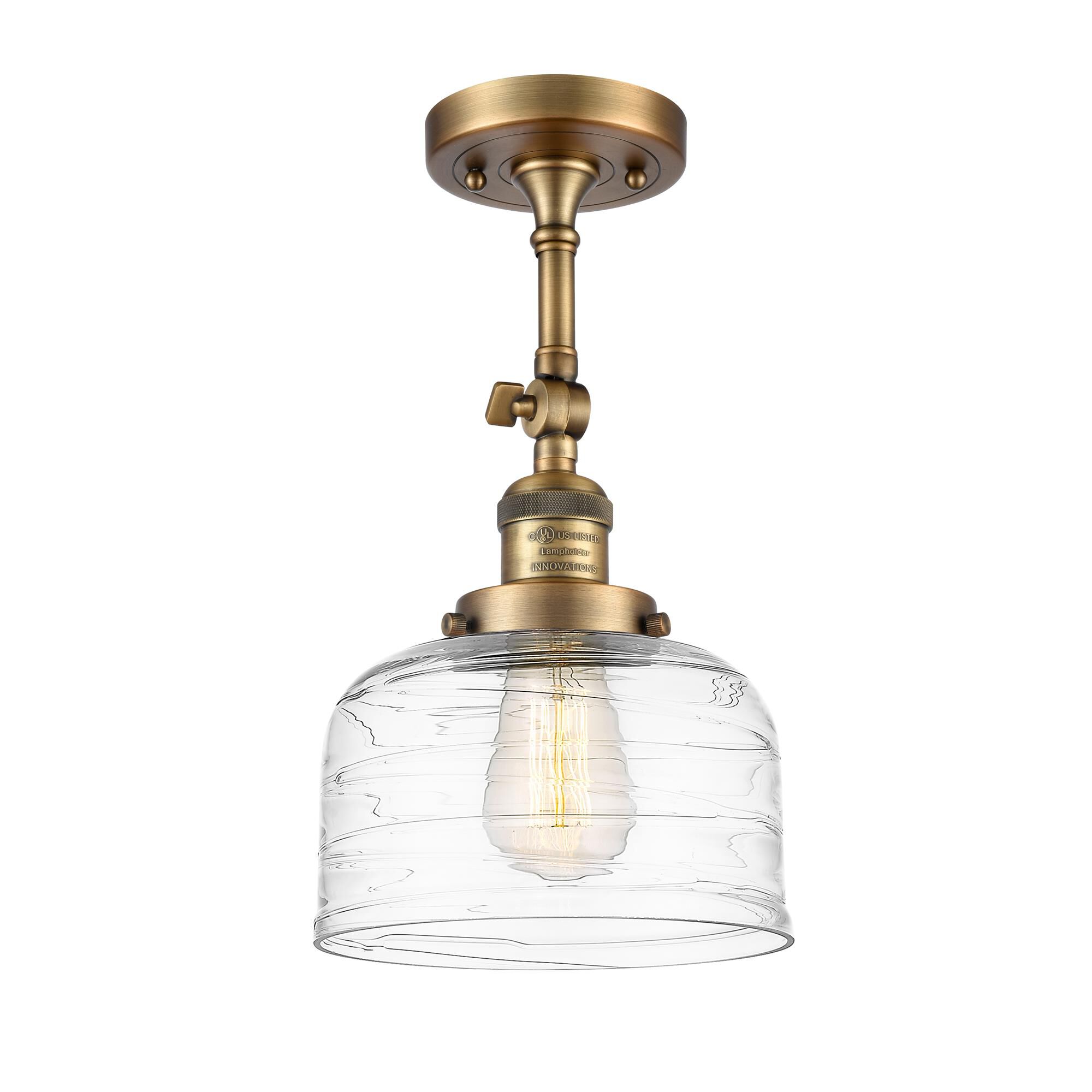 Shown in Brushed Brass finish and Deco Swirl glass