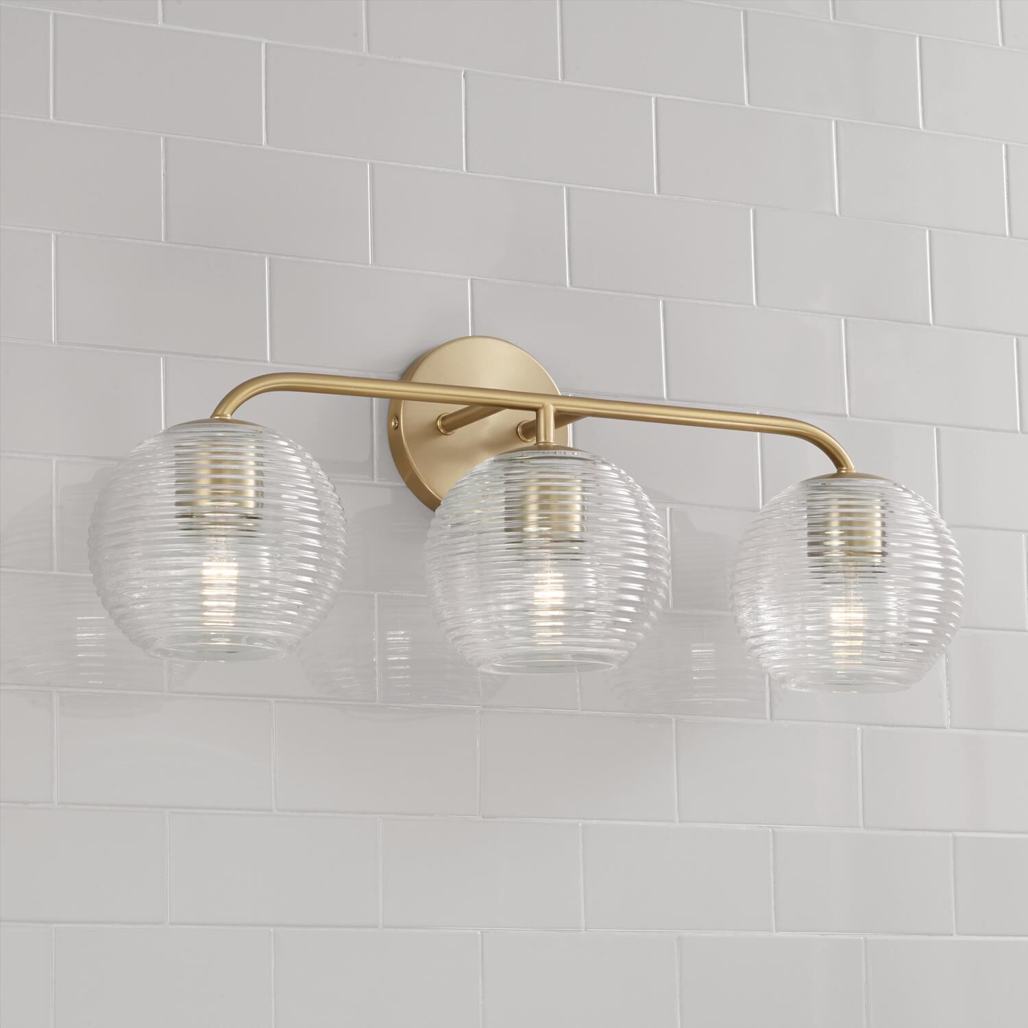 Shown in Matte Brass finish and Clear Ribbed glass