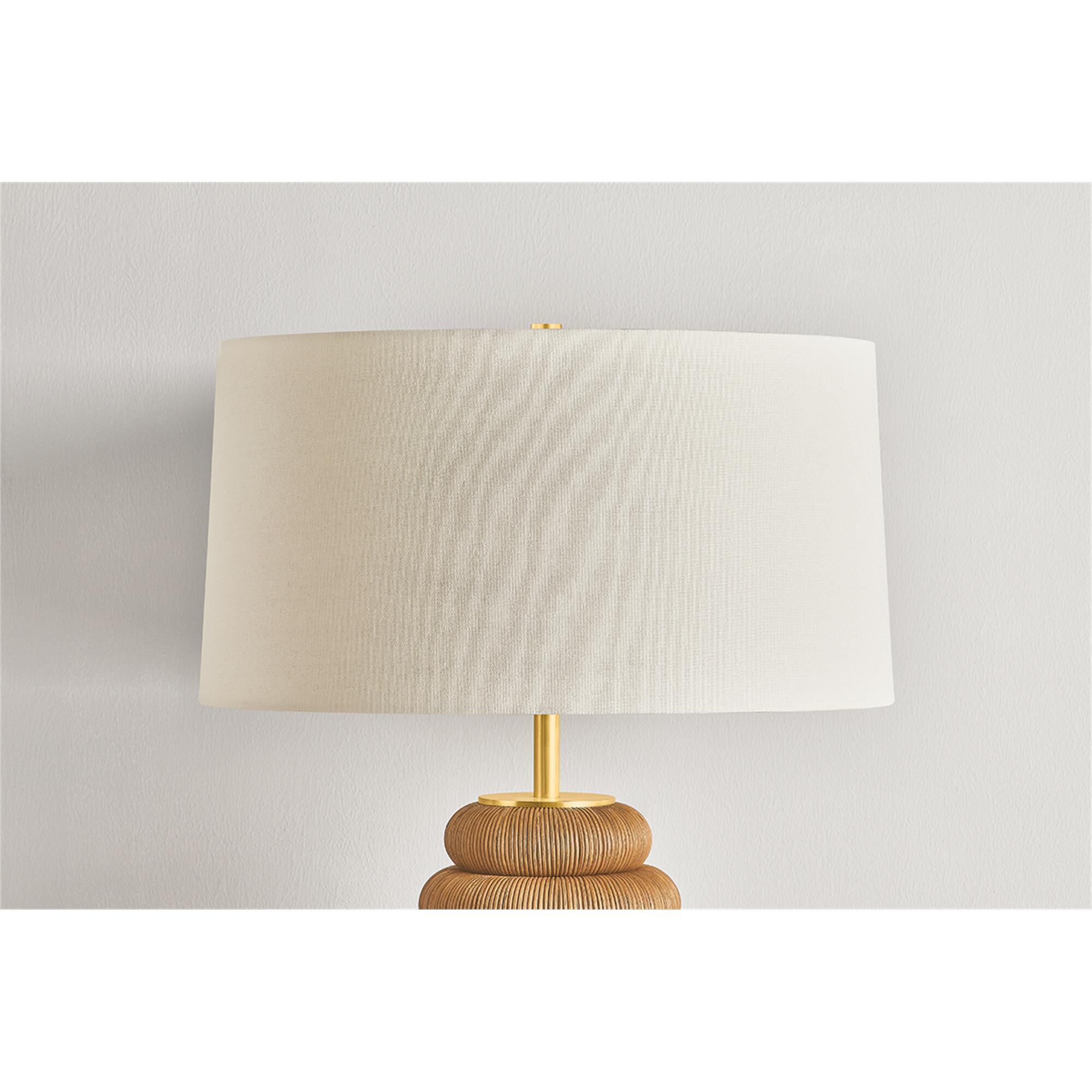 Shown in Aged Brass finish and White Linen shade