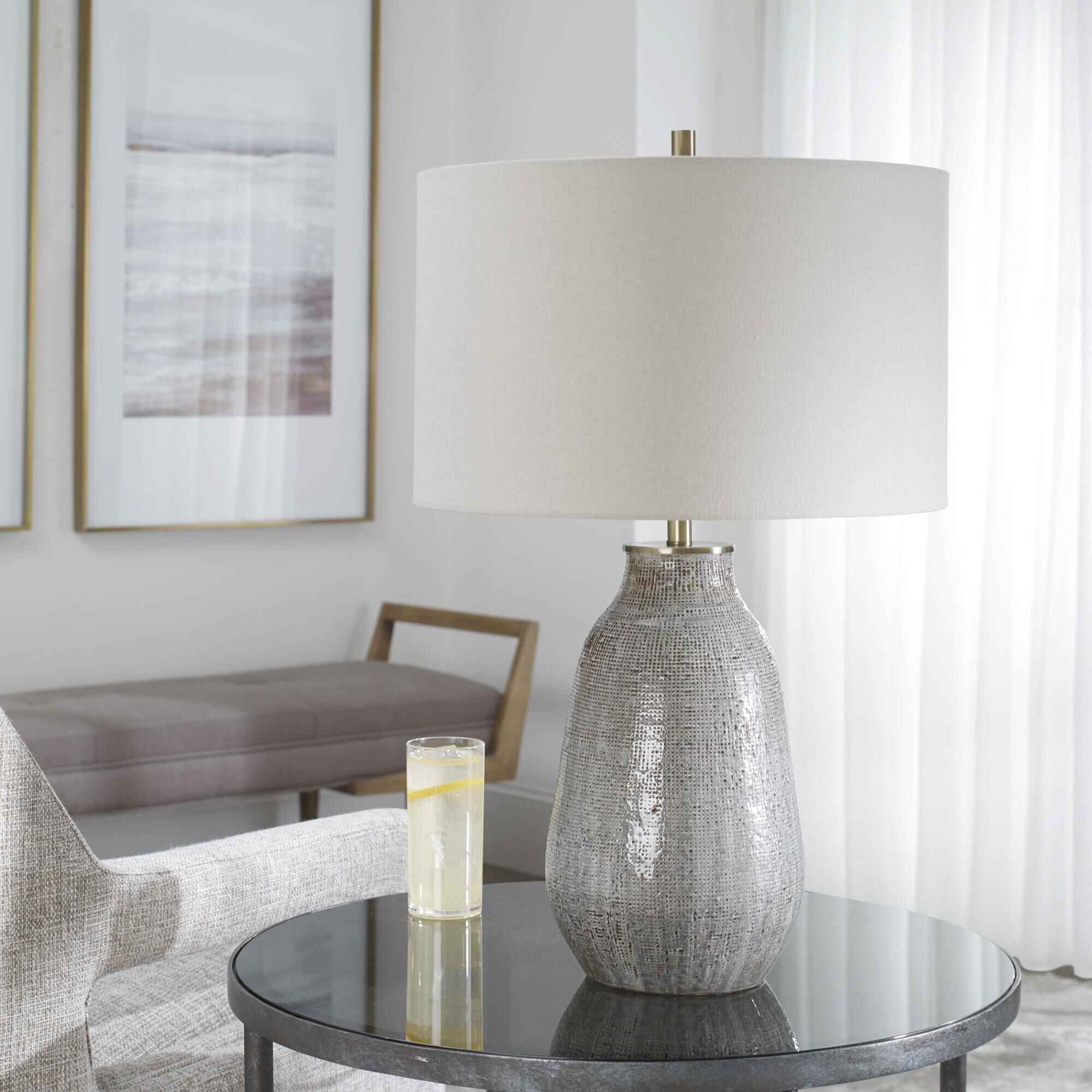 Shown in Exhibiting A Handcrafted Look, This Ceramic Table Lamp Features A Textured Finish Reminiscent Of Wov finish and Round Hardback Drum shade