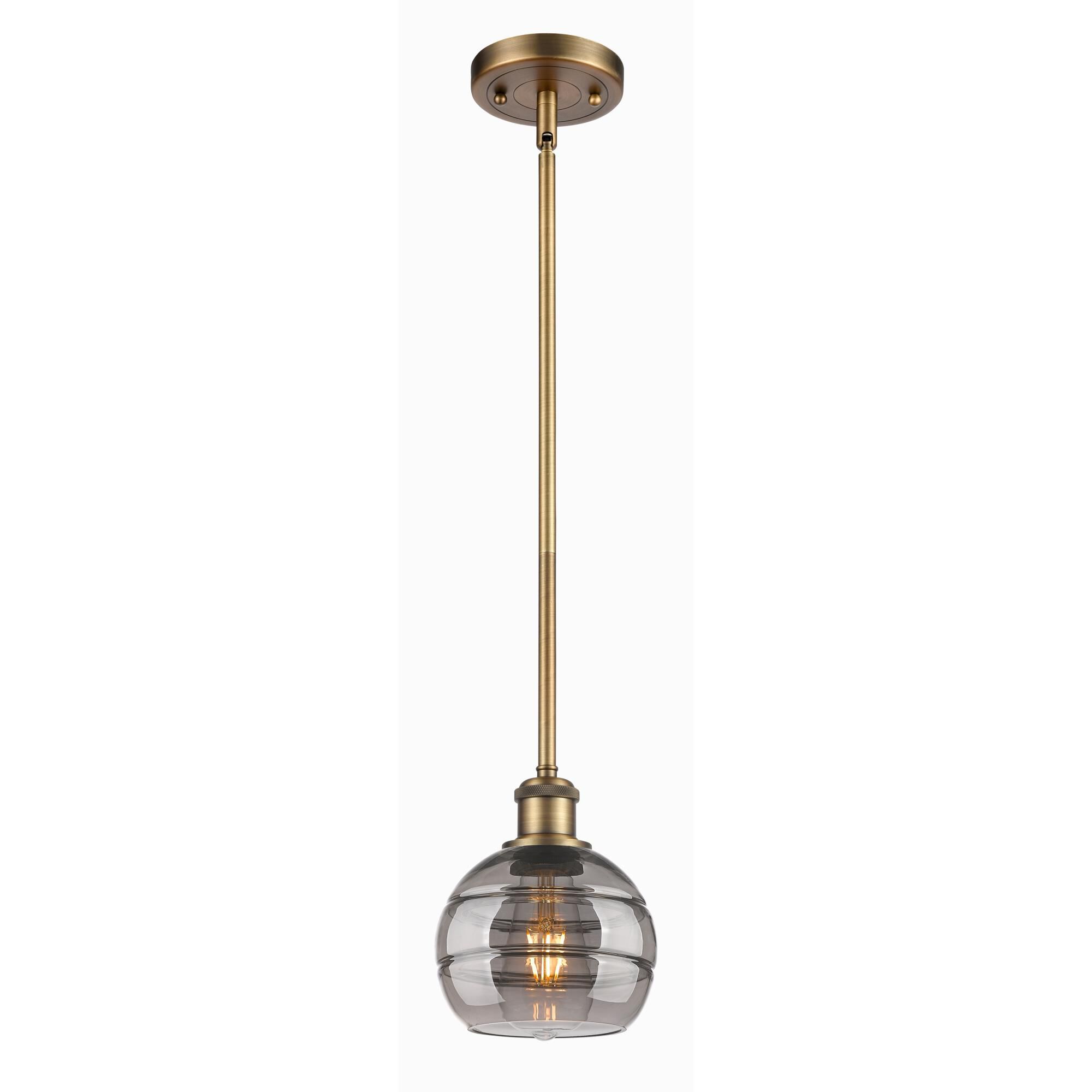 Shown in Brushed Brass finish and Light Smoke glass