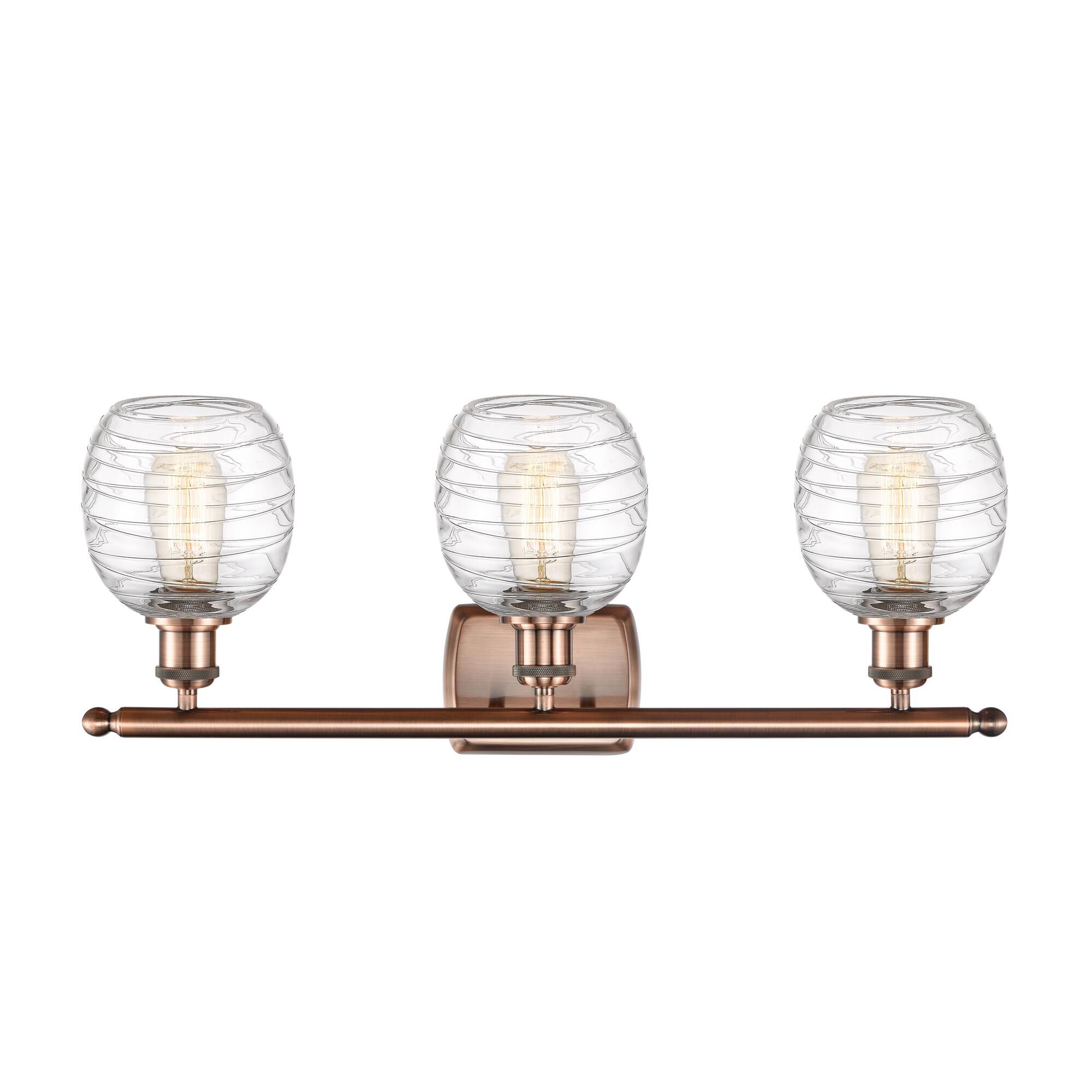 Shown in Antique Copper finish and Deco Swirl glass