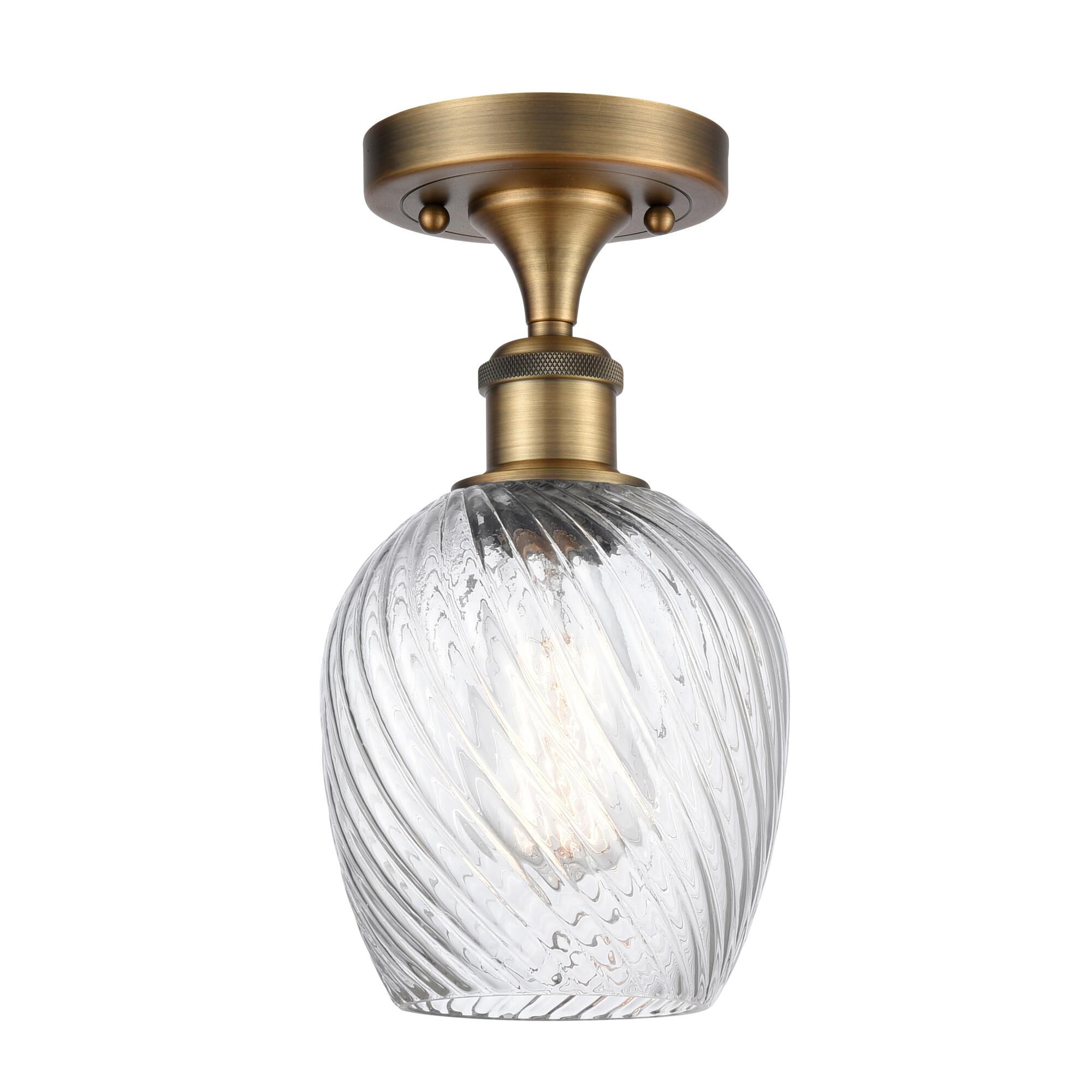 Shown in Brushed Brass finish and Globe glass and Glass shade
