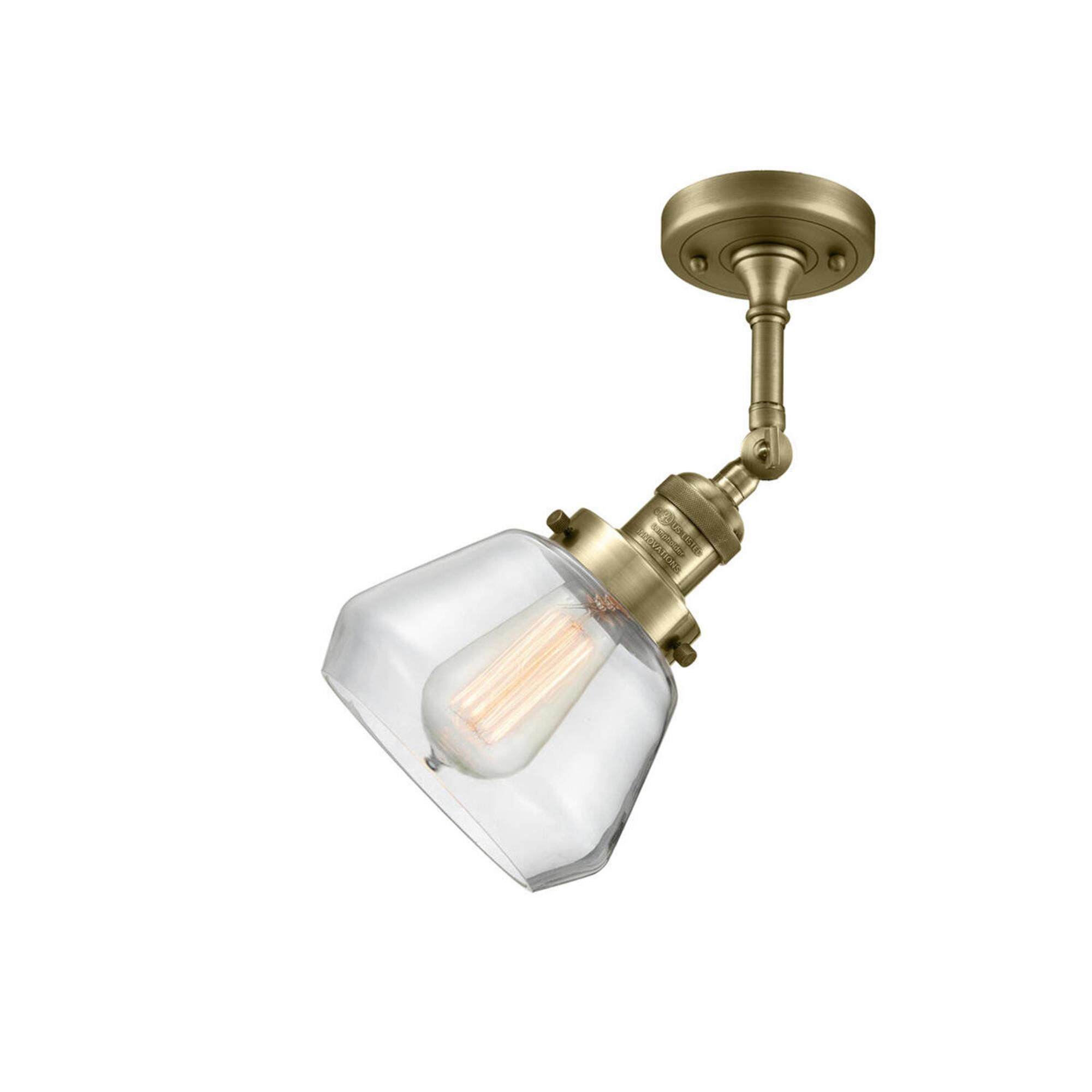 Shown in Antique Brass finish and Clear glass and None accent