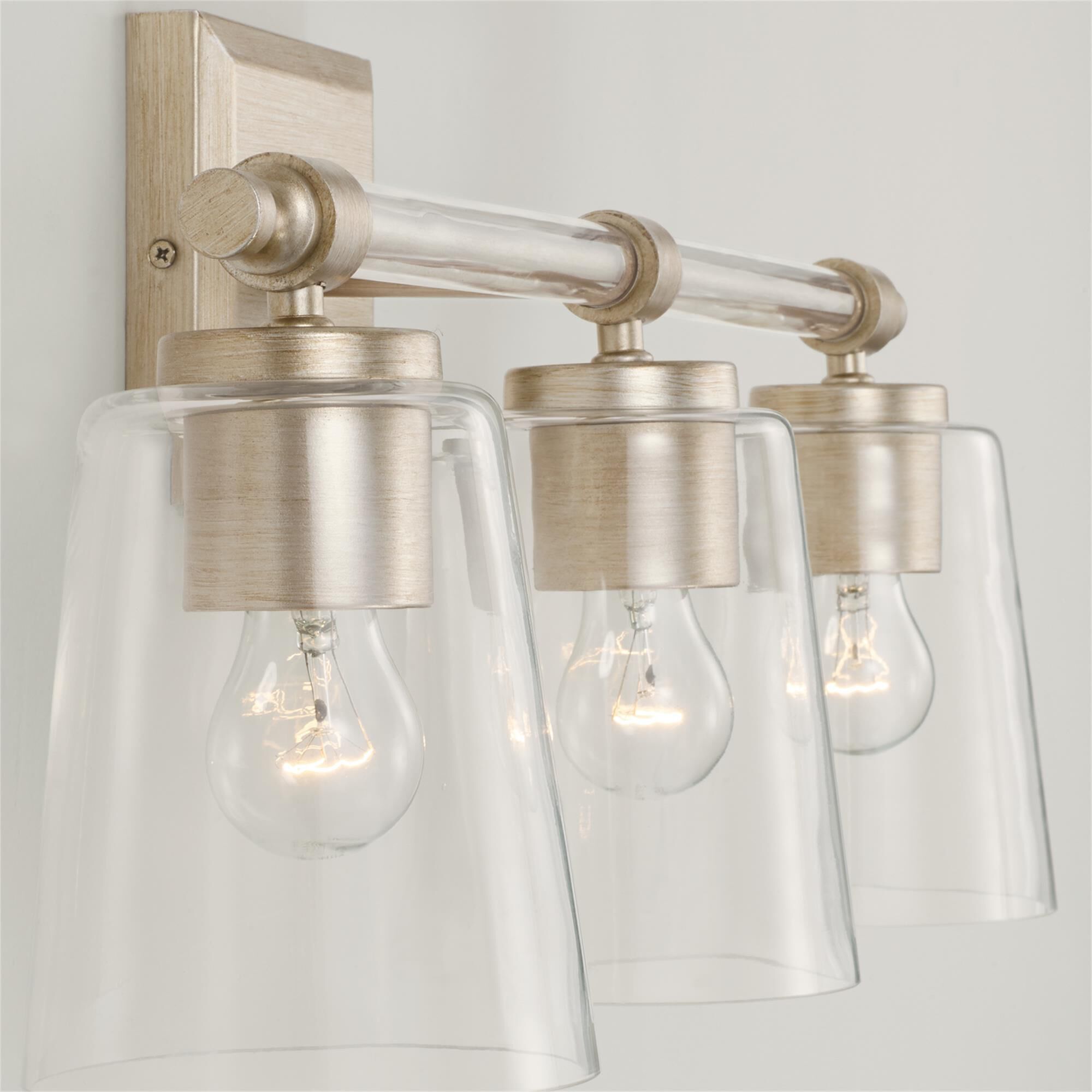 Shown in Brushed Champagne finish and Clear glass