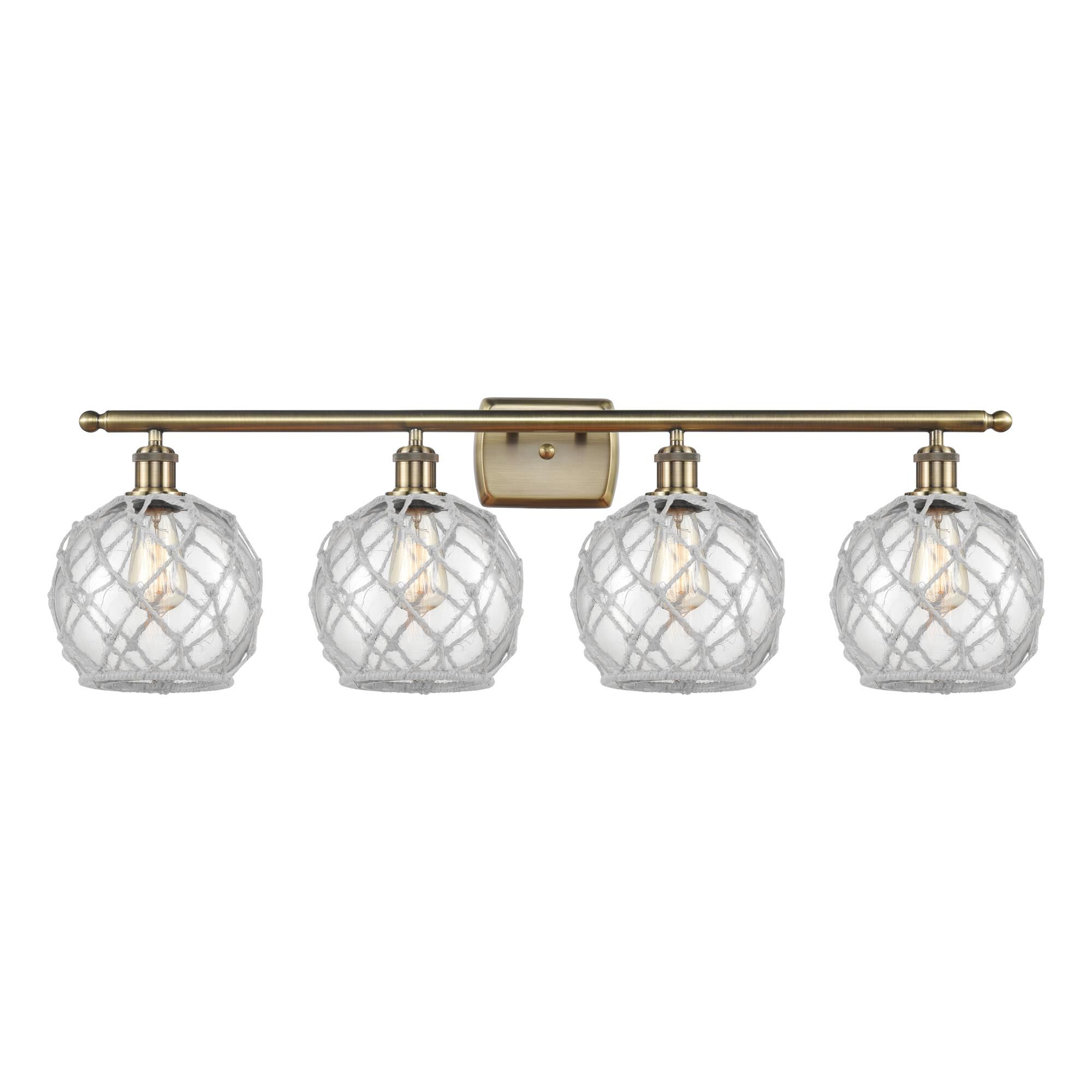 Shown in Antique Brass finish and Clear with White Rope glass