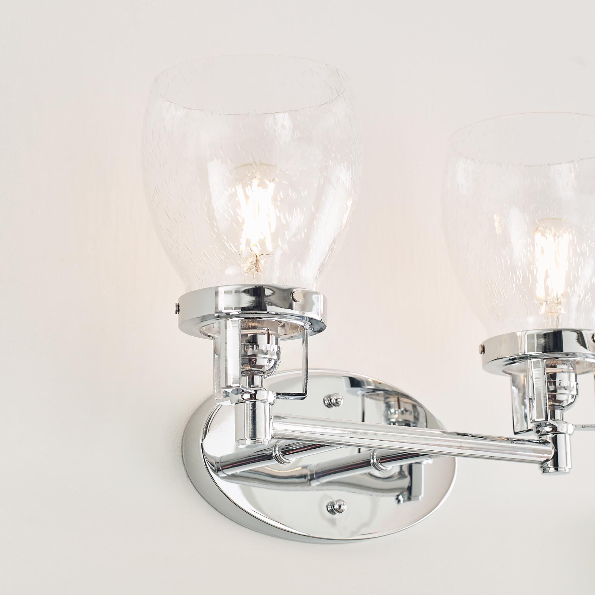 Shown in Chrome finish and Clear Seeded glass