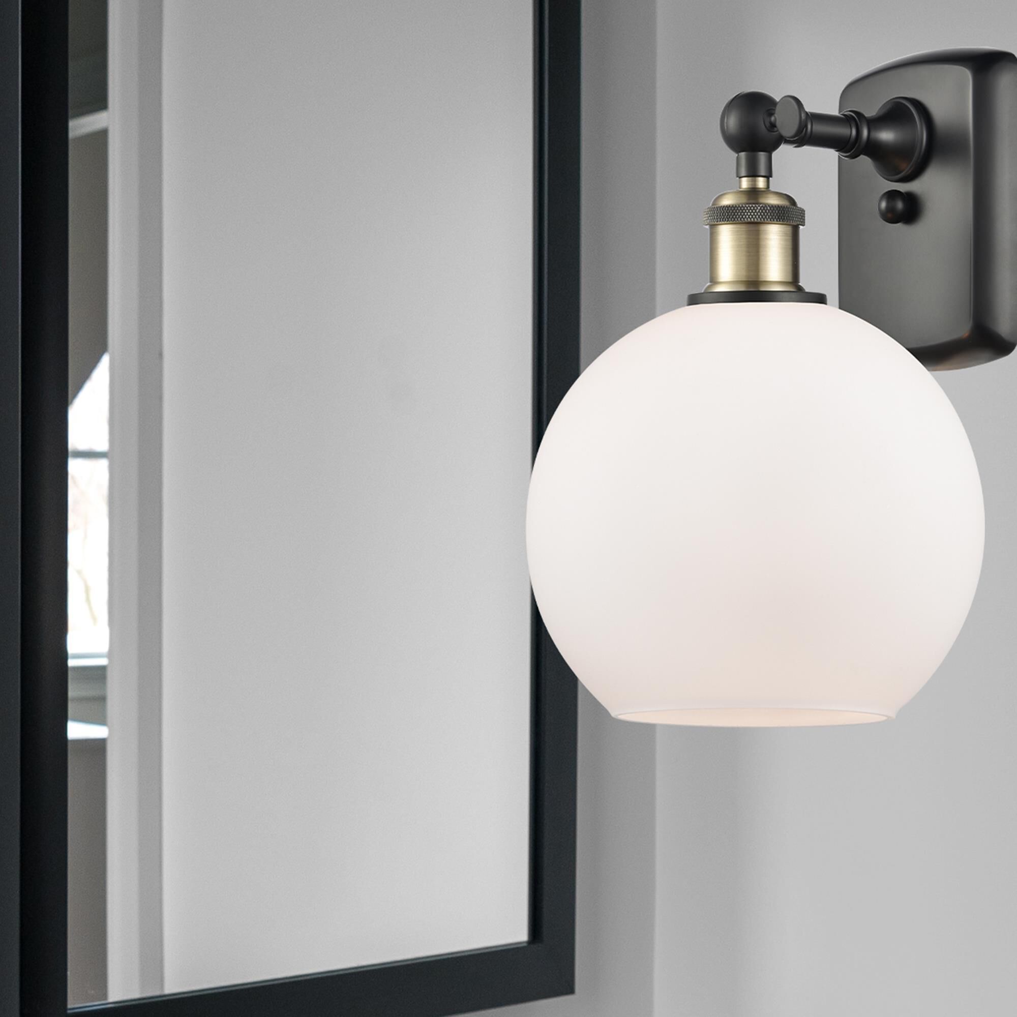 Shown in Black Antique Brass finish and Cased Matte White glass